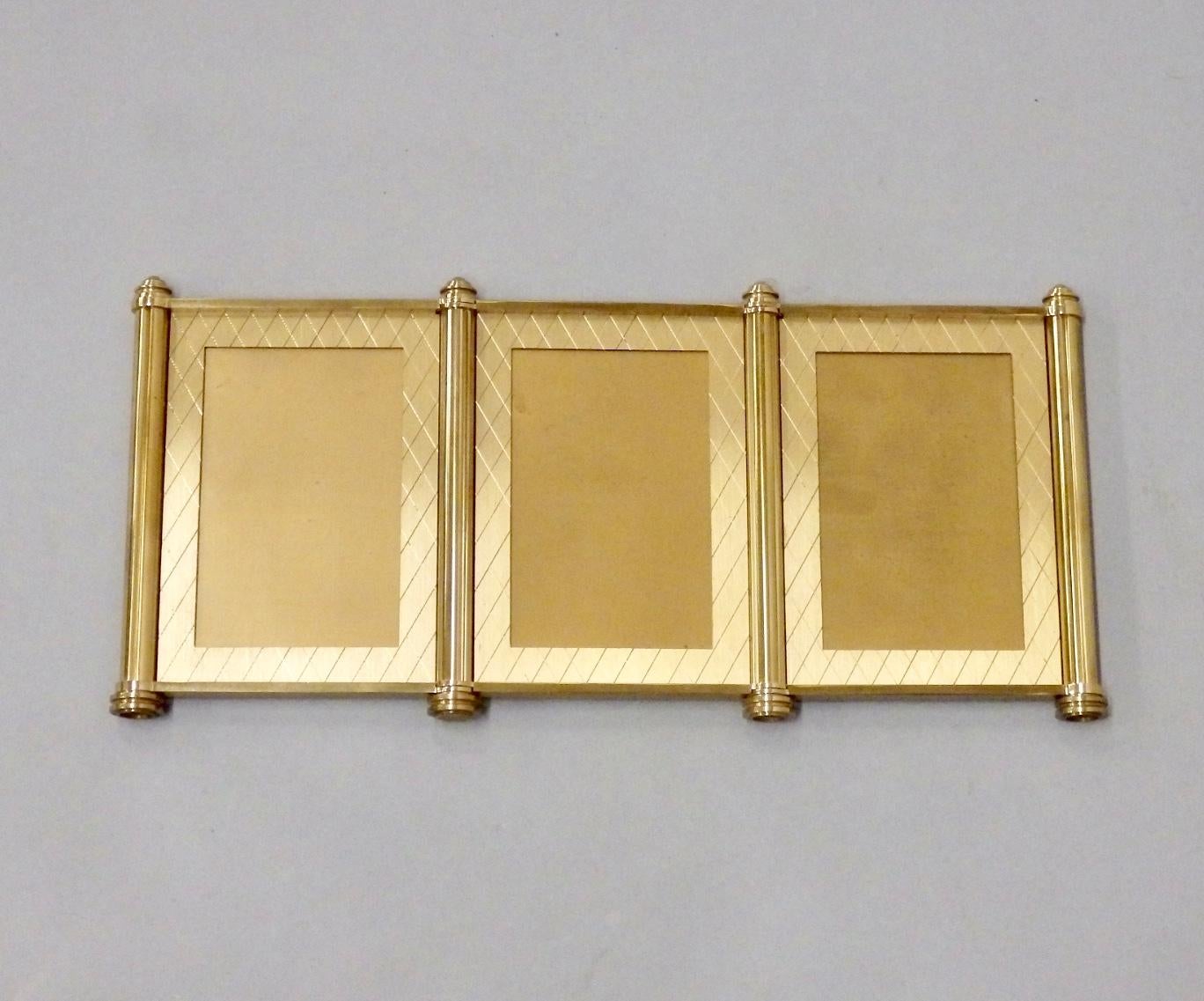 Jewel like quality machined brass picture frames. Original box shows minor wear . Marked Made in Switzerland . Cross hatch design on brass face very much in the style of Tommi Parzinger .