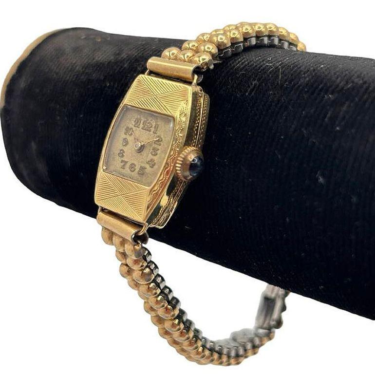 Original Rolled-Gold Art Deco women's wristwatch exudes timeless elegance with geometric patterns along the case of the watch case and a 17-jewel hand winding 210SS Veri movement by Gruen. The bubble-style crystal adds a touch of vintage charm,