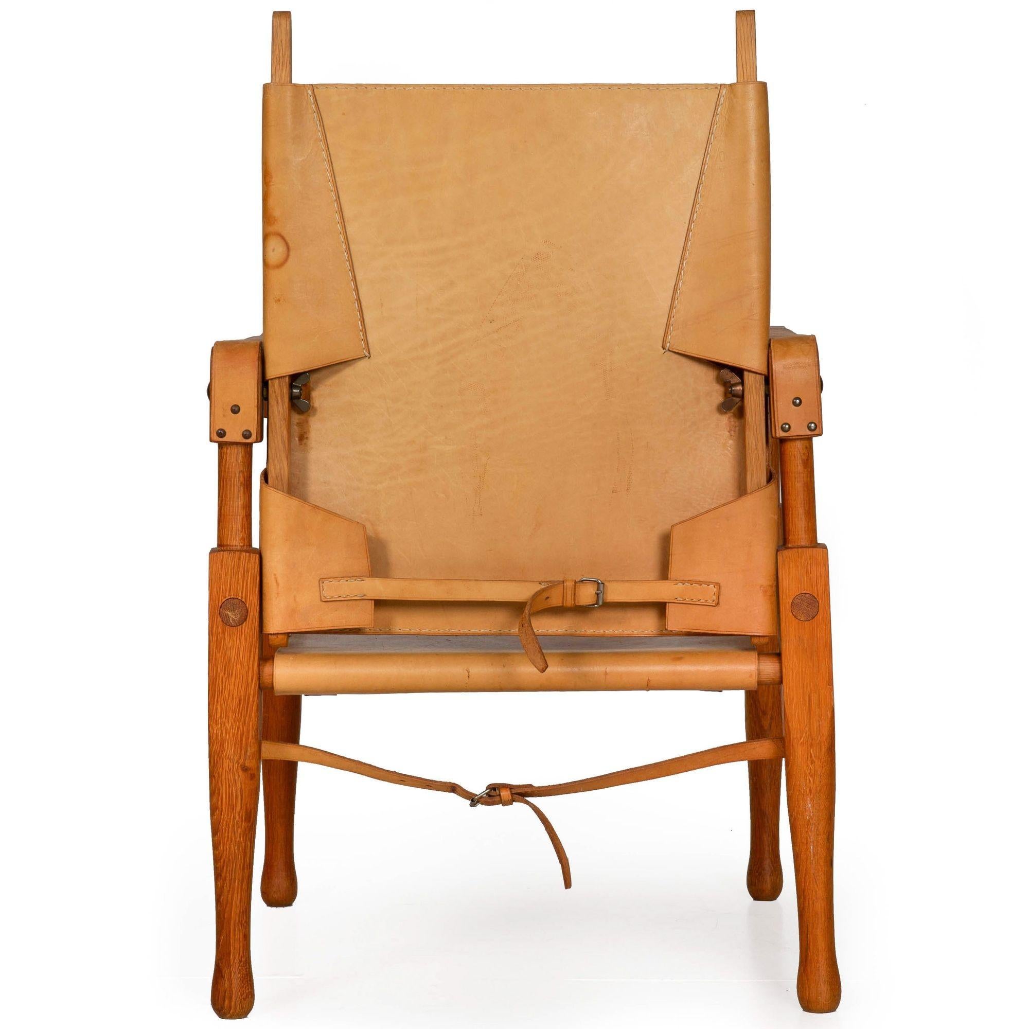 20th Century Swiss Mid-Century Modern Leather and Oak Safari Chair by Wilhelm Kienzle For Sale
