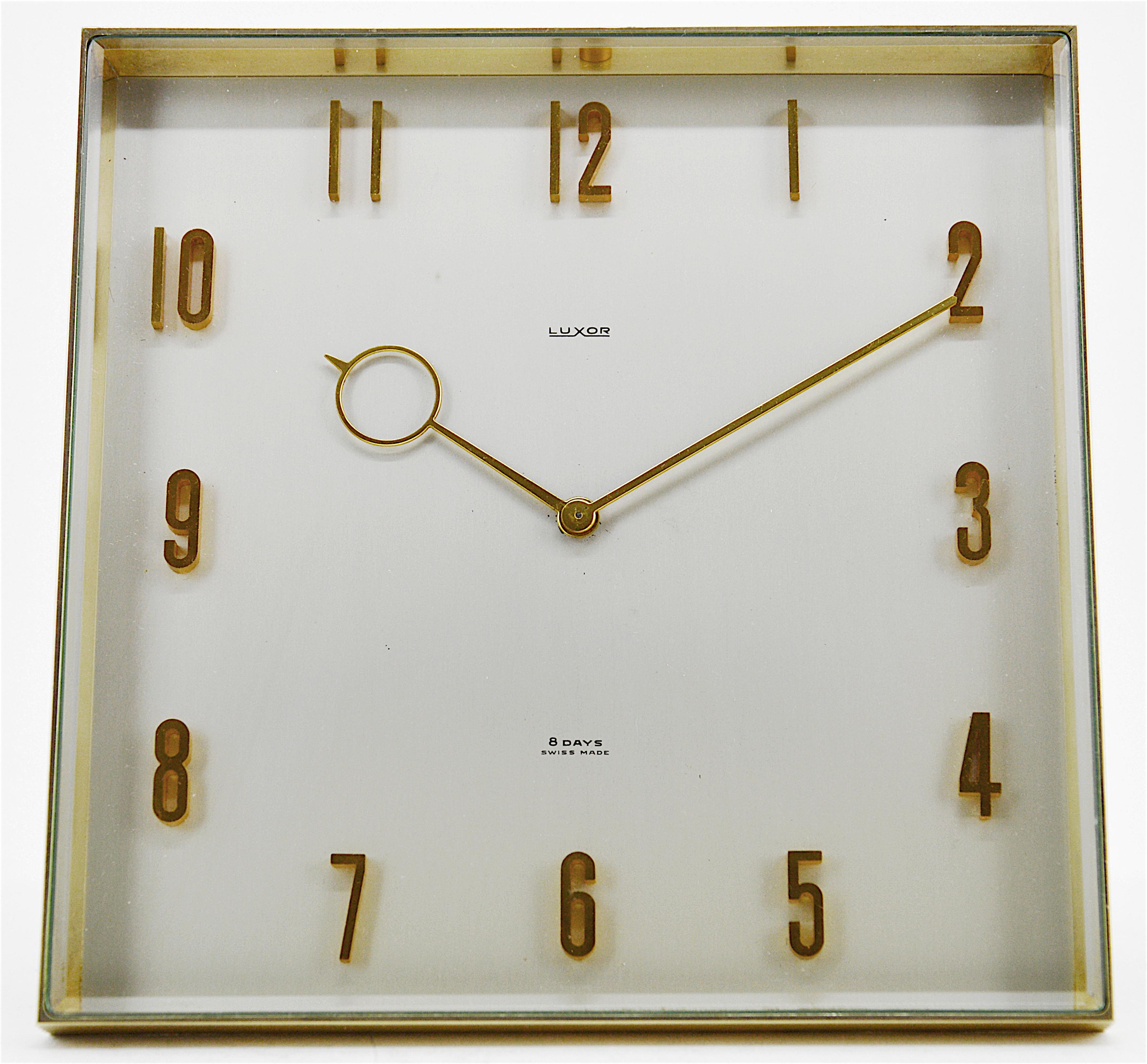 Any fair offer will be examined with the utmost attention, please send a message. Midcentury table clock by Luxor, Switzerland, 1950s. Brass and glass. Thick beveled front glass. 8 days movement. Measures: Height 5.9