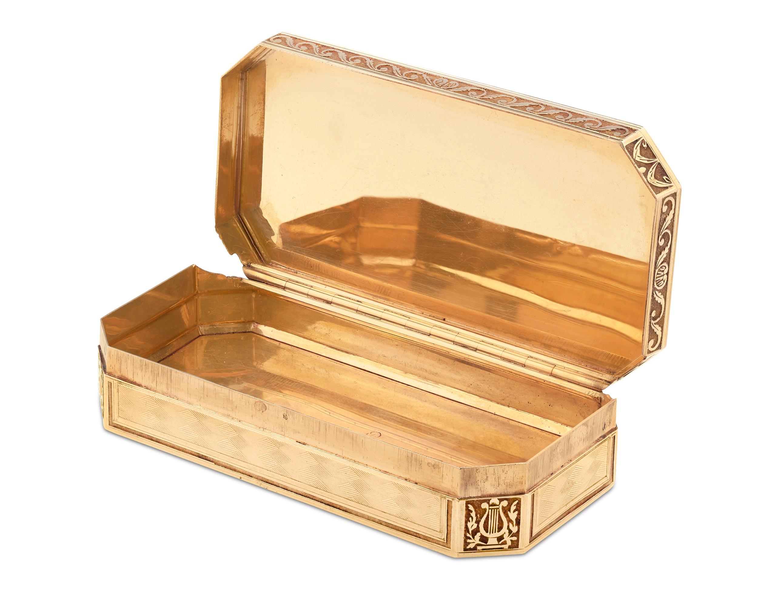This exceptional multicolored gold snuffbox is a work of impeccable Swiss artistry. Flawless hand-chased and engraved gold elements adorn this rare 19th century box, and dynamic floral swags and musical instruments accompany the finely etched