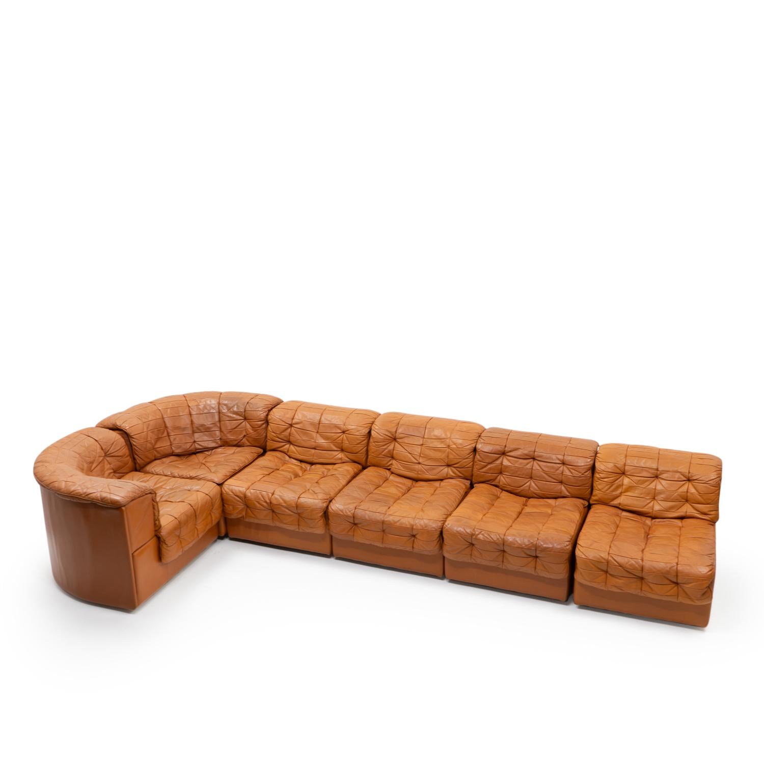De Sede six-piece modular sofa DS-11 in beautiful patinated leather:

The sofa is a patchwork design made from pigmented aniline leather, which typically gives a very lived look due to the open nature of the material.

This sofa is very comfortable