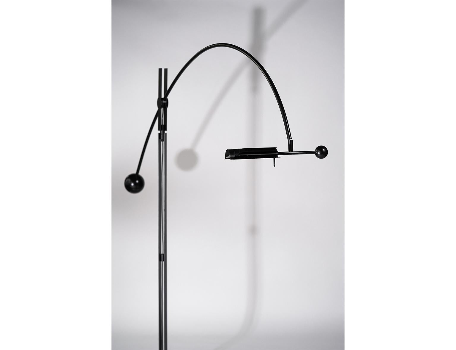 Swizz perfection. 

Engineered beauty - Model 823, a multi-adjustable floor lamp with a metal sphere counterweight. With strong identity and perfection, this Swizz International floor lamp takes on the room. 
Manufactured in Europe, possibly