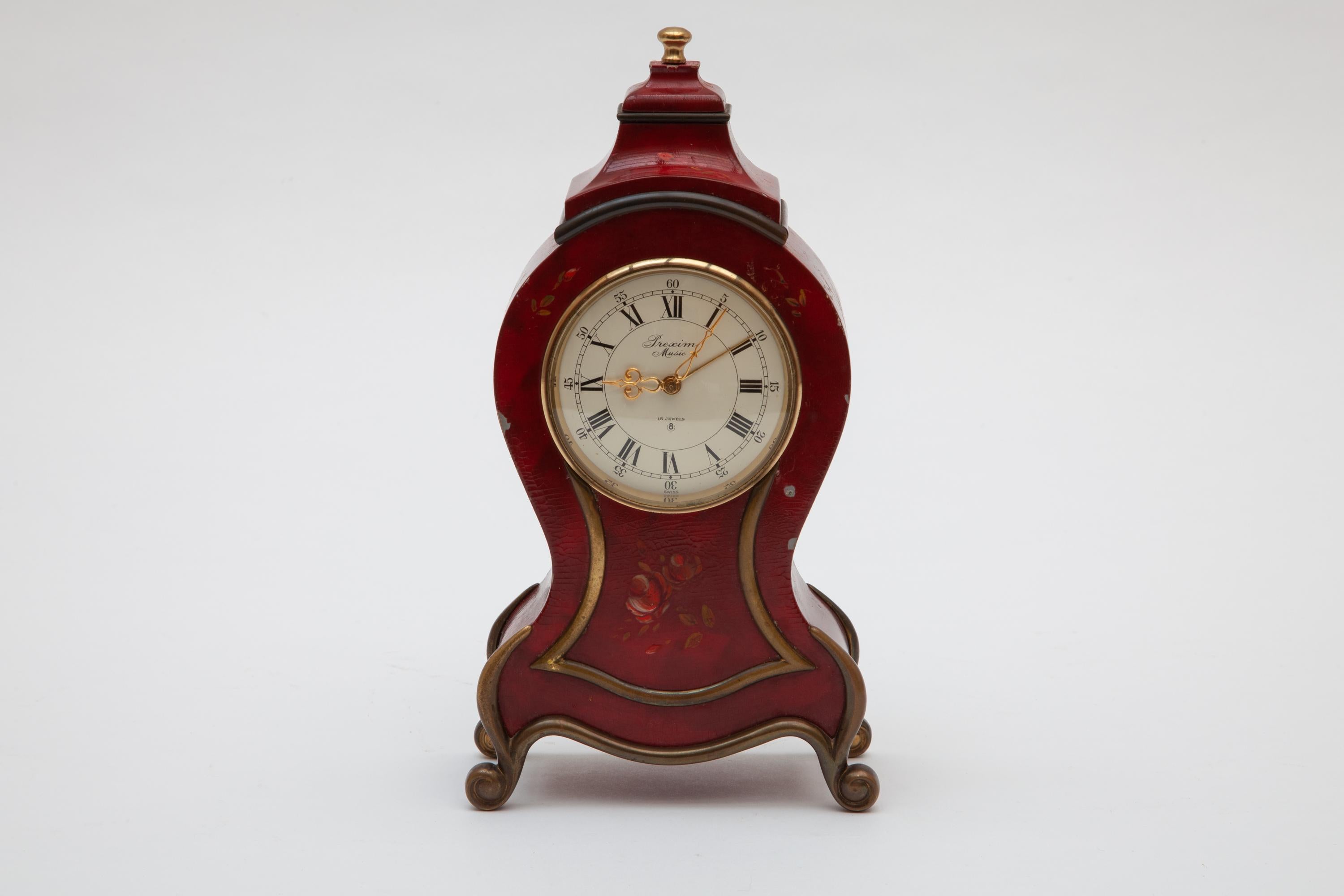 Questo orologio antico Prexim Music Box, splendidamente dipinto a mano, sarebbe una bellissima aggiunta a qualsiasi casa. La sveglia svizzera a 15 Jewell, a carica manuale, tiene il tempo. L'altezza è di 9,5