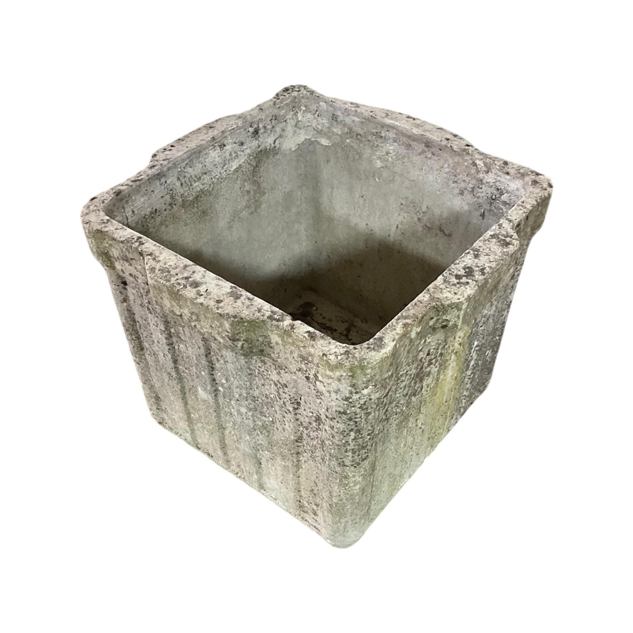 Small square shape planter with ribbed designing along the 4 sides. Made out of a concrete composite. Originates from Switzerland. Circa, 1950's. Designed by Willy Guhl.