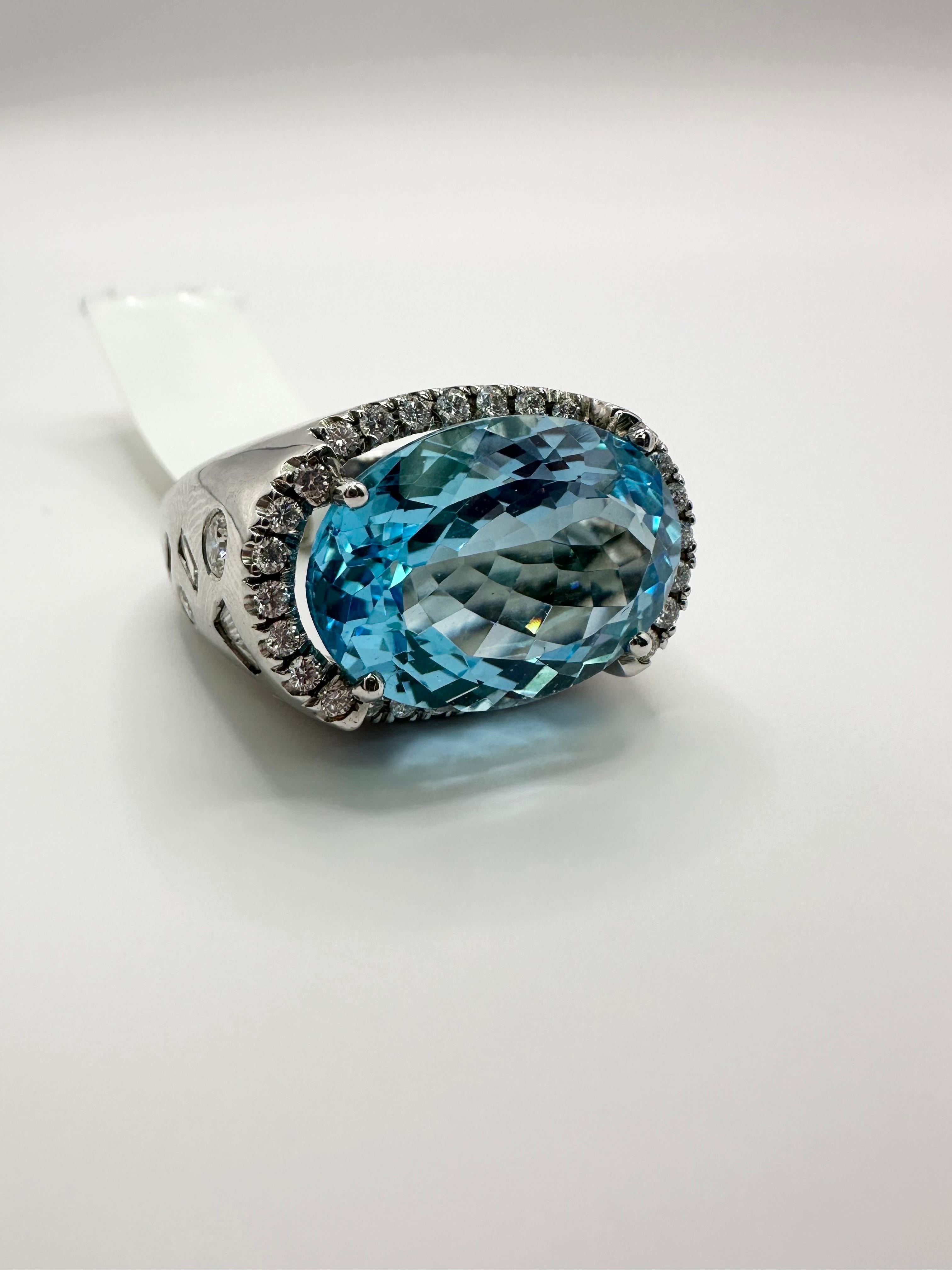 Stunning blue topaz cocktail ring in 14Kt white gold, large center at more than 18 carats and fine quality diamonds weighing 1.45 carats, made so well with hand finish and excellent craftsmanship.

Metal Type: 14KT

Natural Topaz(s): 
Color: