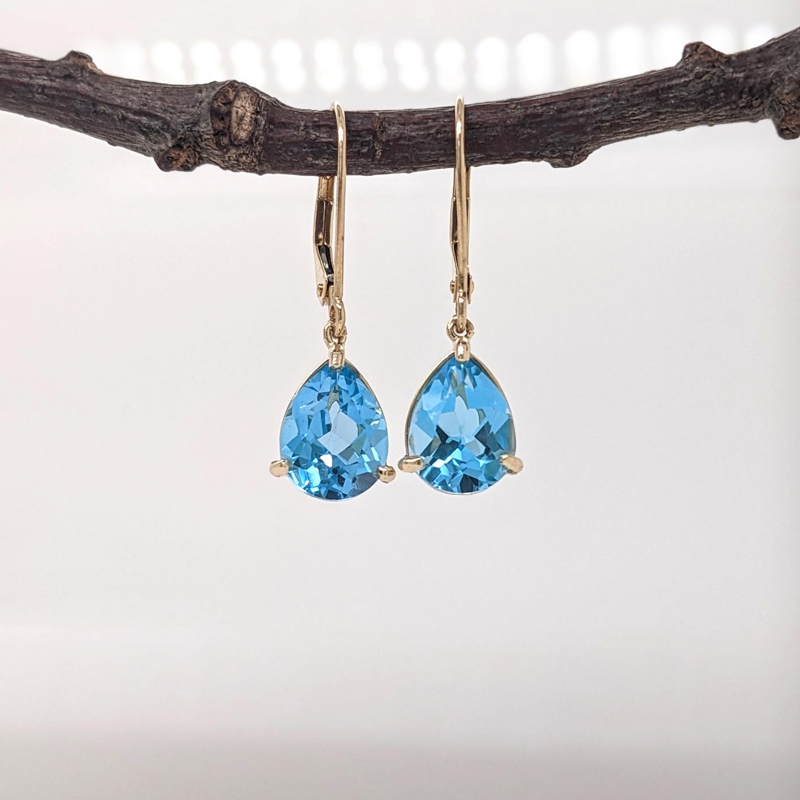 These dangle earrings feature a pair of 1.87 carat weight swiss topaz solitaire gemstones all set in 14k gold. These earrings can be a beautiful november birthstone gift for your loved ones! 

Specifications

Item Type: Earrings
Center Stone: Swiss