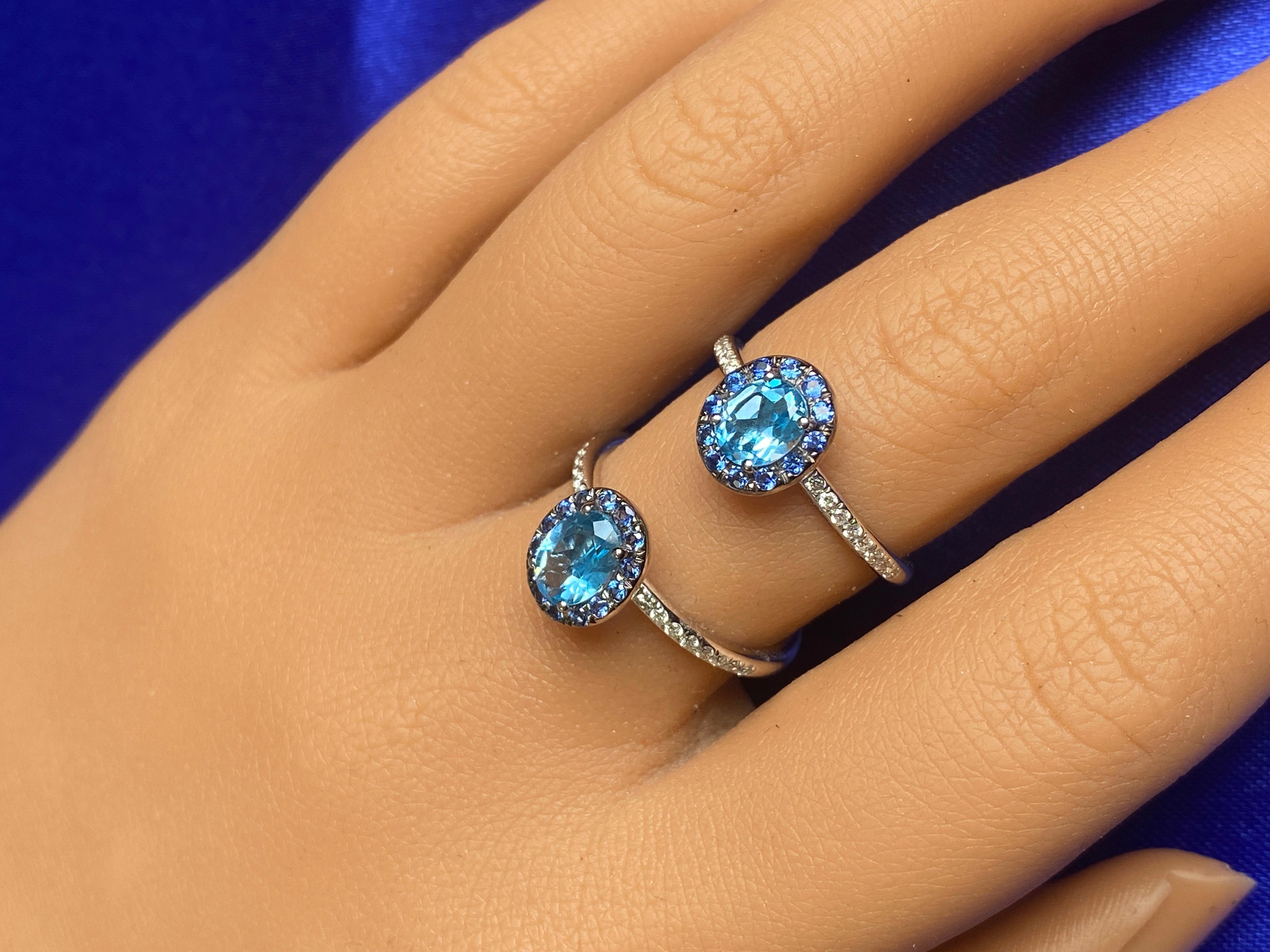 A ring with 3 stones in 1! Starting in the center, a Swiss Blue Topaz. The oval center stone is a variation of a blue topaz! The Swiss blue topaz is a topaz with a nice blue hue! The perfect combination of light and dark makes this topaz one of the