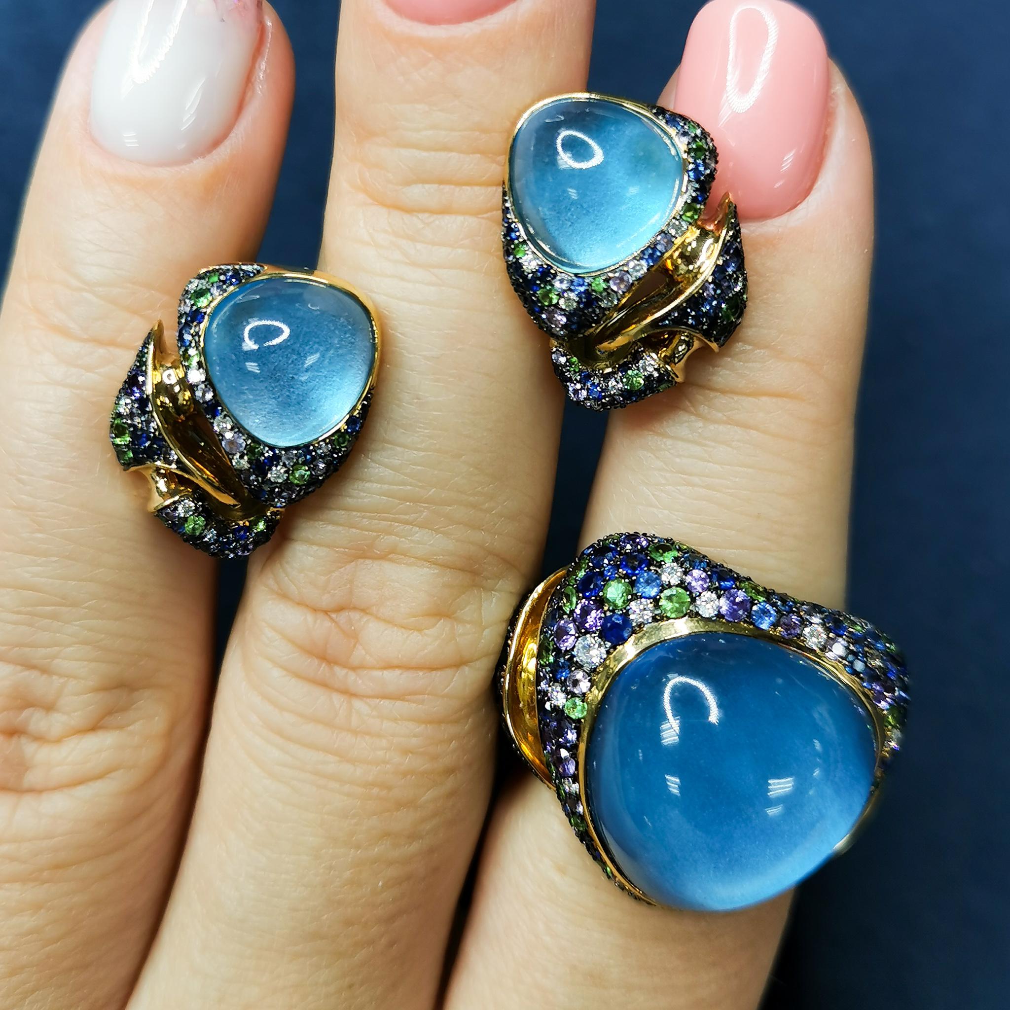 Swiss Topaz Tsavorites Diamonds Sapphires 18 Karat Yellow Gold Suite
All the colors of hot summer are collected in our Suite. Bright Tsavorites, Purple and Blue Sapphires, Diamonds, and a mixture of 18 Karat Yellow and Black Gold. All this is