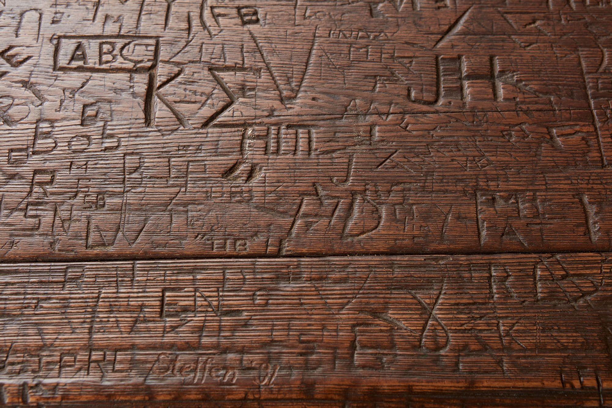 Country Swiss Trestle Table with Graffiti Carvings For Sale