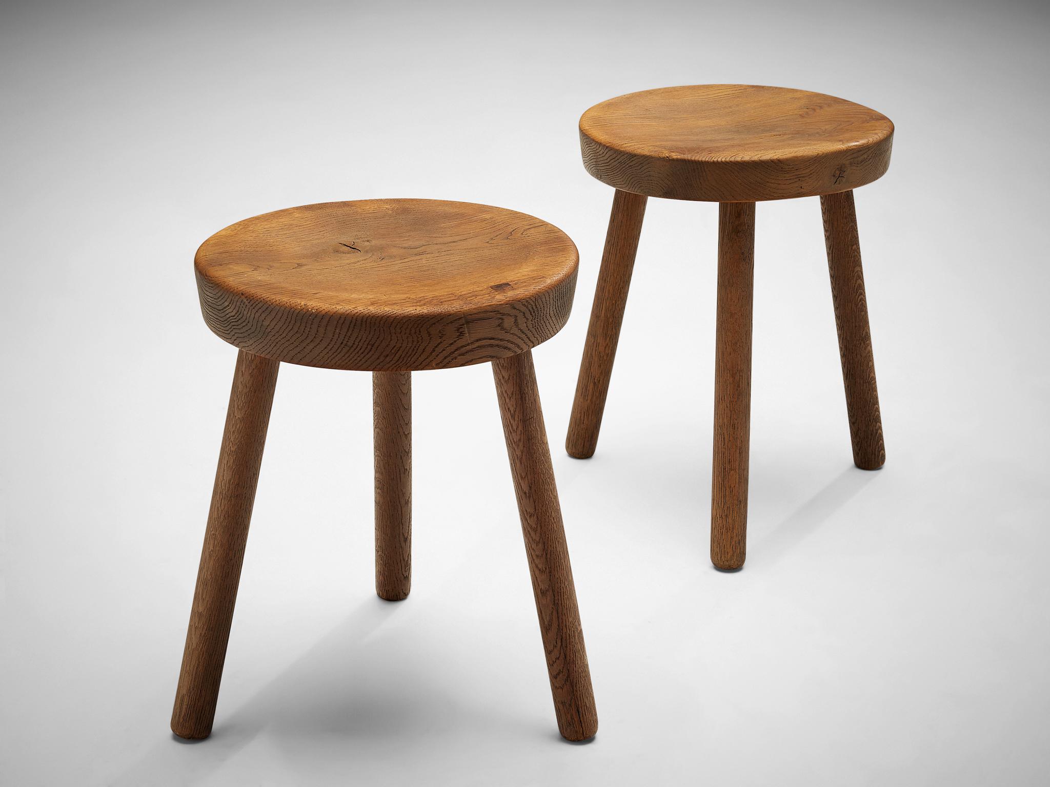 Tripod stools or side tables, solid oak, Switzerland, 1960s-1970s

Beautiful crafted oak stools originating from the exhibition center in St. Gallen, Switzerland. The seat is handcrafted to have a small dip for better comfort. With their simple yet