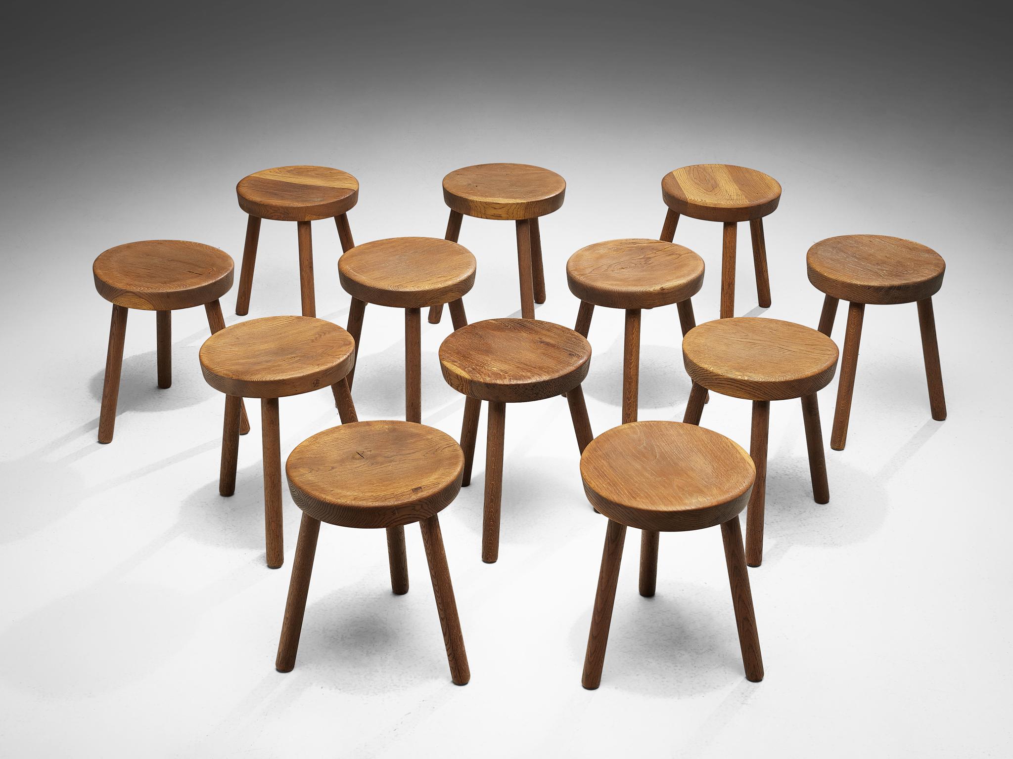 Tripod stools or side tables, solid oak, Switzerland, 1960s-1970s.

Beautiful crafted oak stools originating from the exhibition center in St. Gallen, Switzerland. The seat is handcrafted to have a small dip for better comfort. With their simple