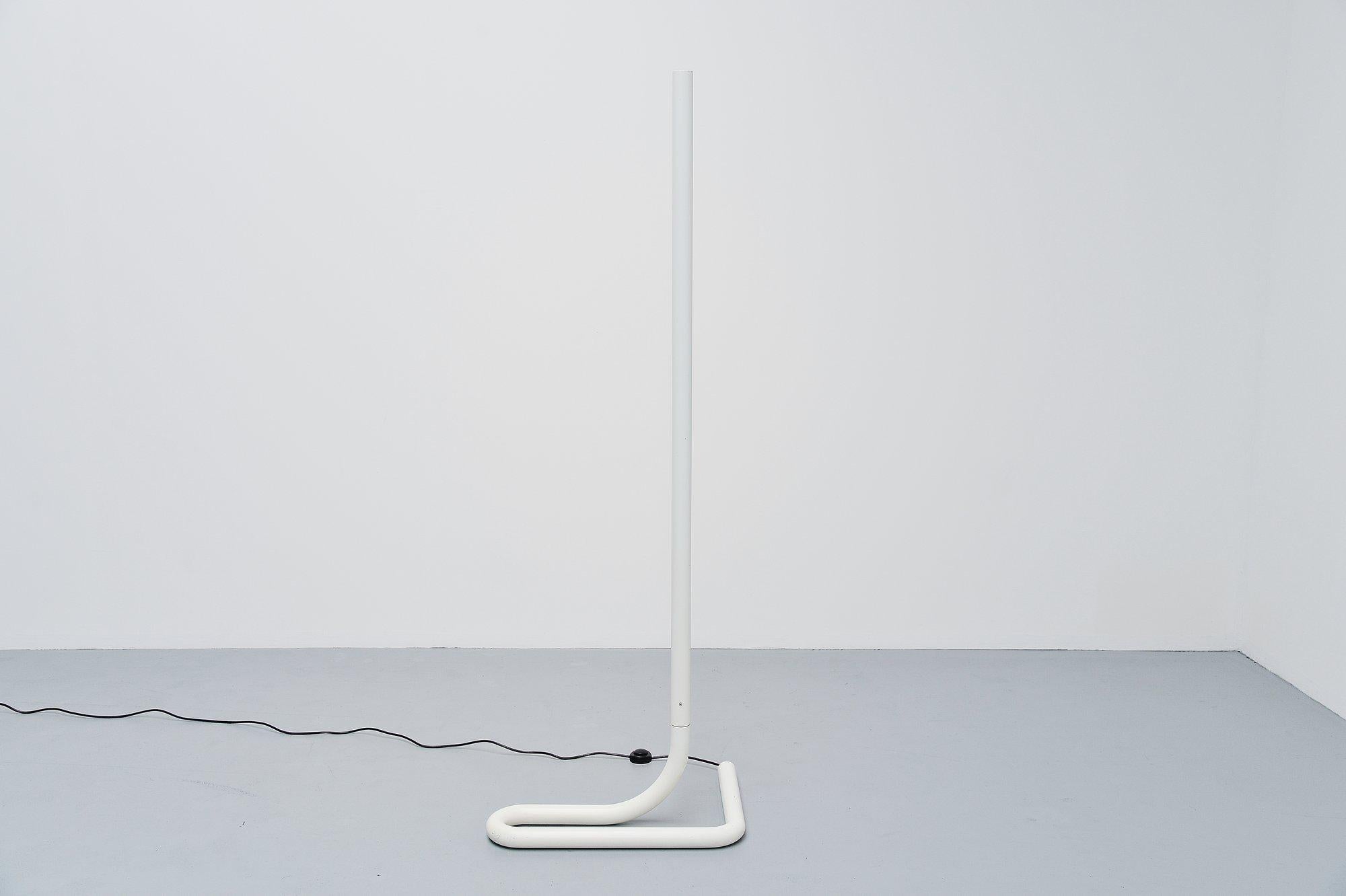 Nice modernist floor lamp designed after the famous TC2 by Aldo van den Nieuwelaar, this lamp was made in Switzerland in the 1970s. It has a white painted aluminum tubular frame and has a TL light for nice indirect light. Gives very nice light when