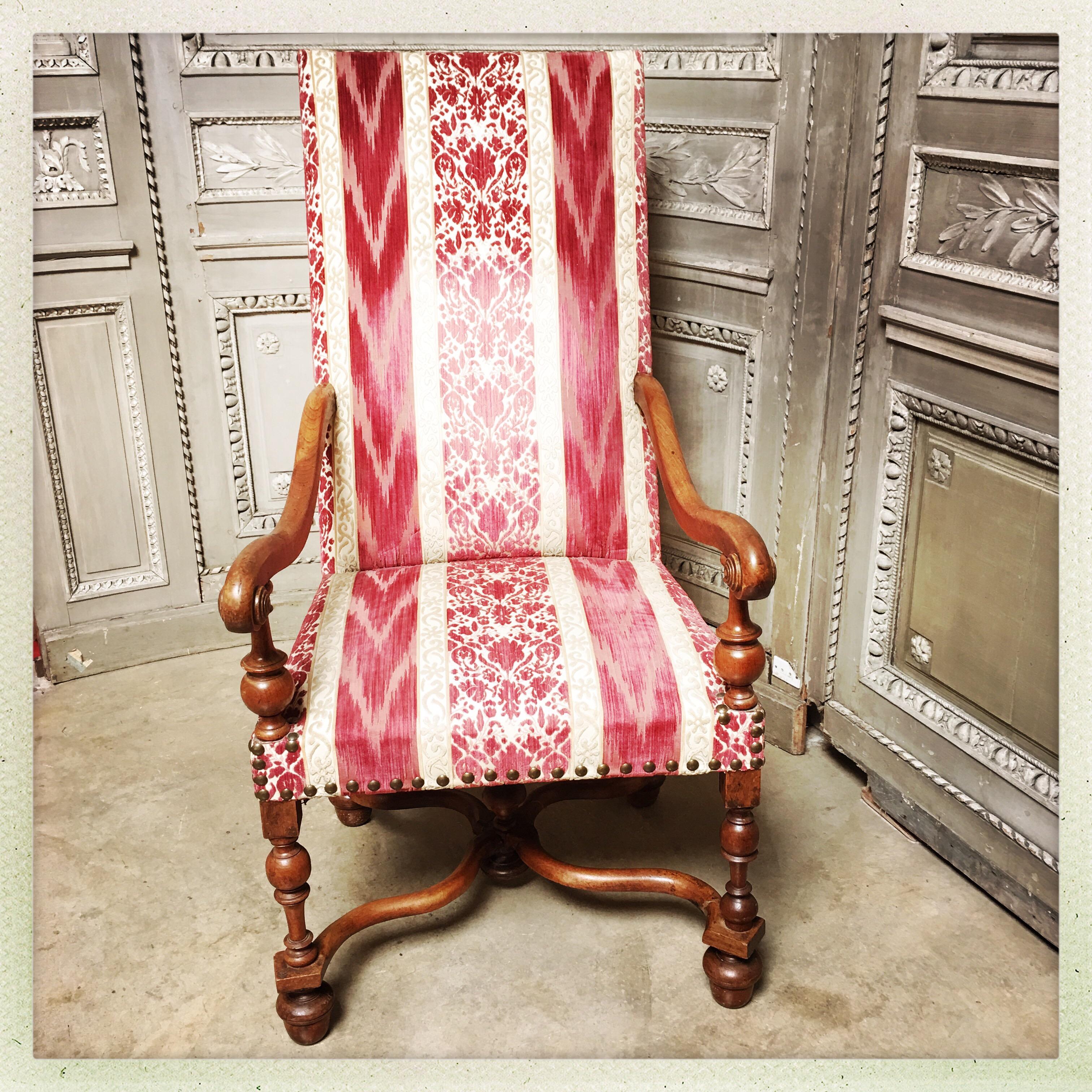 A charming swiss carved walnut Louis XIII style armchair.