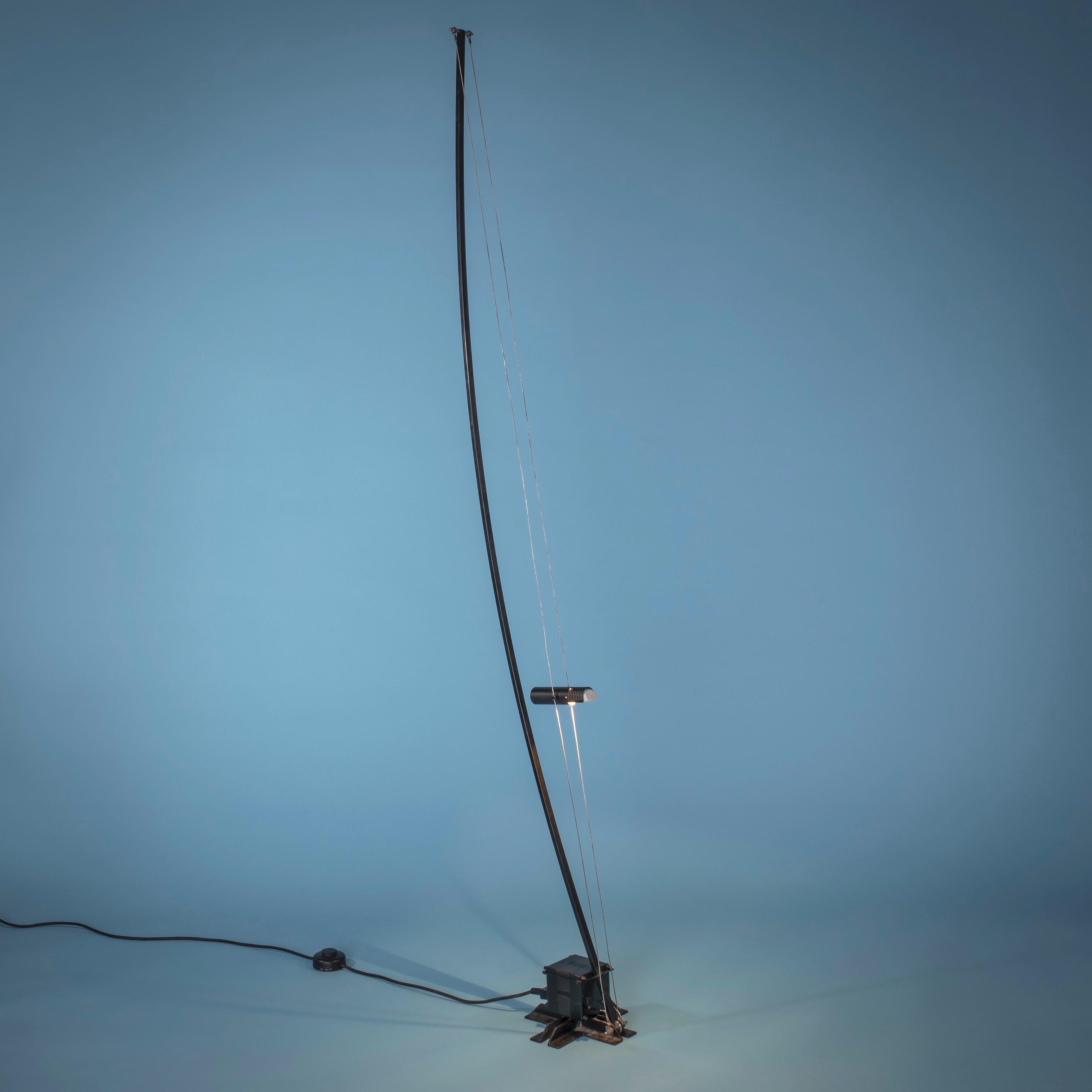 Swiss work

Floor lamp, Stuttgart, circa 1987

Black lacquered metal and steel wire, reflector sliding on two taut cables
Publisher's label 