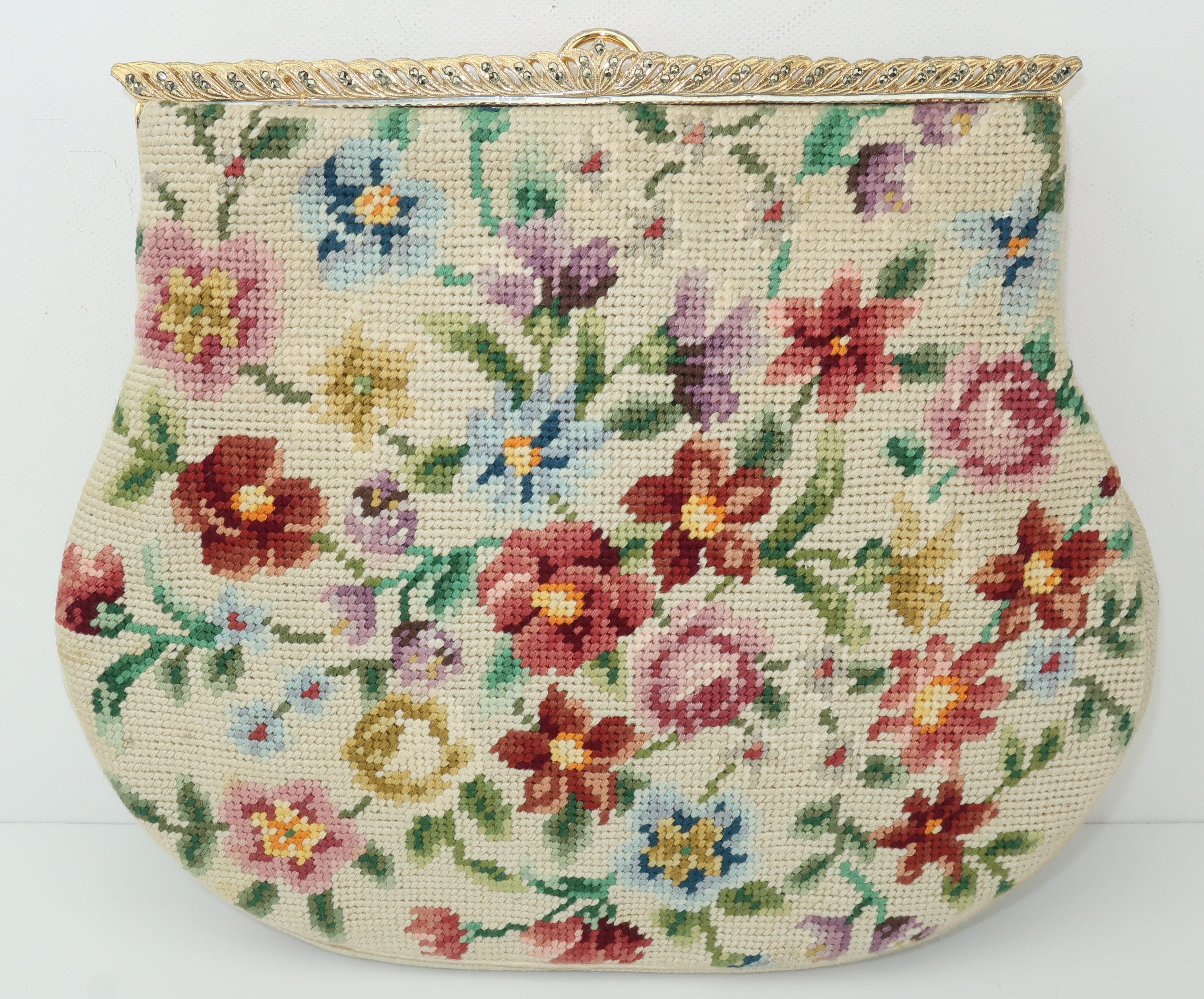 Granny bag chic!  Switkes handbags were designed by artist, Stan Switkes, in the 1940's and 1950's.  This charming floral needlepoint handbag is characteristic of his designs incorporating a floral bouquet in shades of antique white, browns, blues,