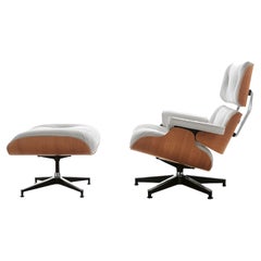 Swivel armchair with pouf Alivar Mvsevm 717 Charles and Ray Eames - White