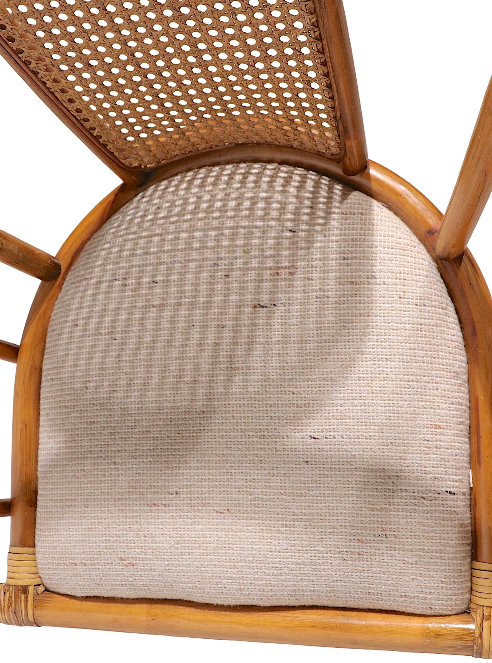 High Style Mid Century swivel bamboo chair designed by Henry Olko. This example is in very fine, original, clean and ready to use condition. Olko pieces are becoming harder and harder to find, this is a classic item from his body of work.
 Total H