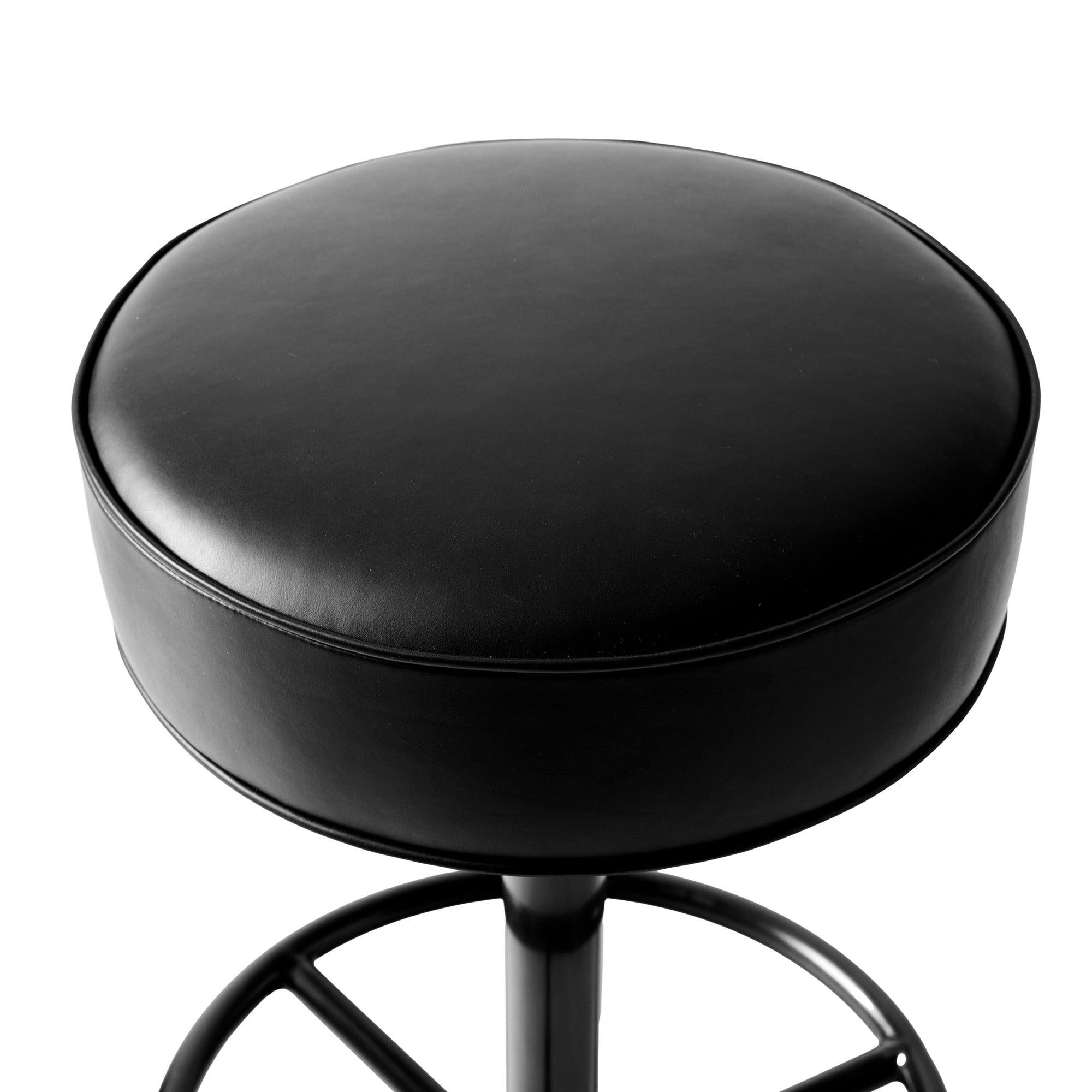 A custom bar stool with an upholstered leather seat on a patinated steel base.