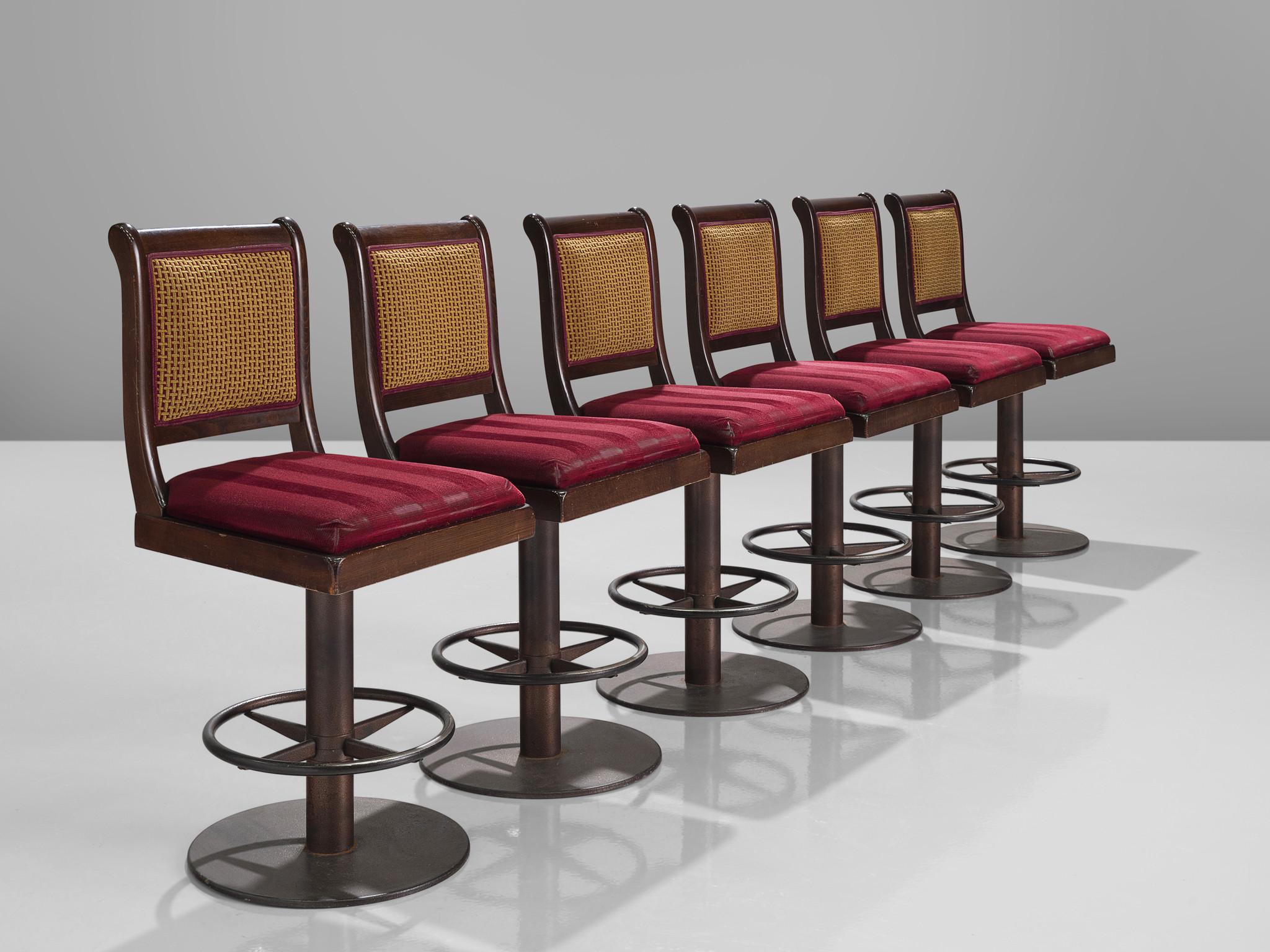 Swivel bar stools, fabric, metal, stained beech, Europe, 1990s

These solid bar stools exude a subtle elegance while delivering an ergonomic seating experience. Their substantial seat and backrest, coupled with a round footrest, ensure comfort. For