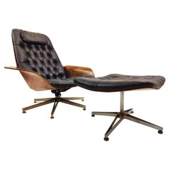 Swivel Black Leather Armchair, Plywood Armrests and Ottoman, George Mulhauser
