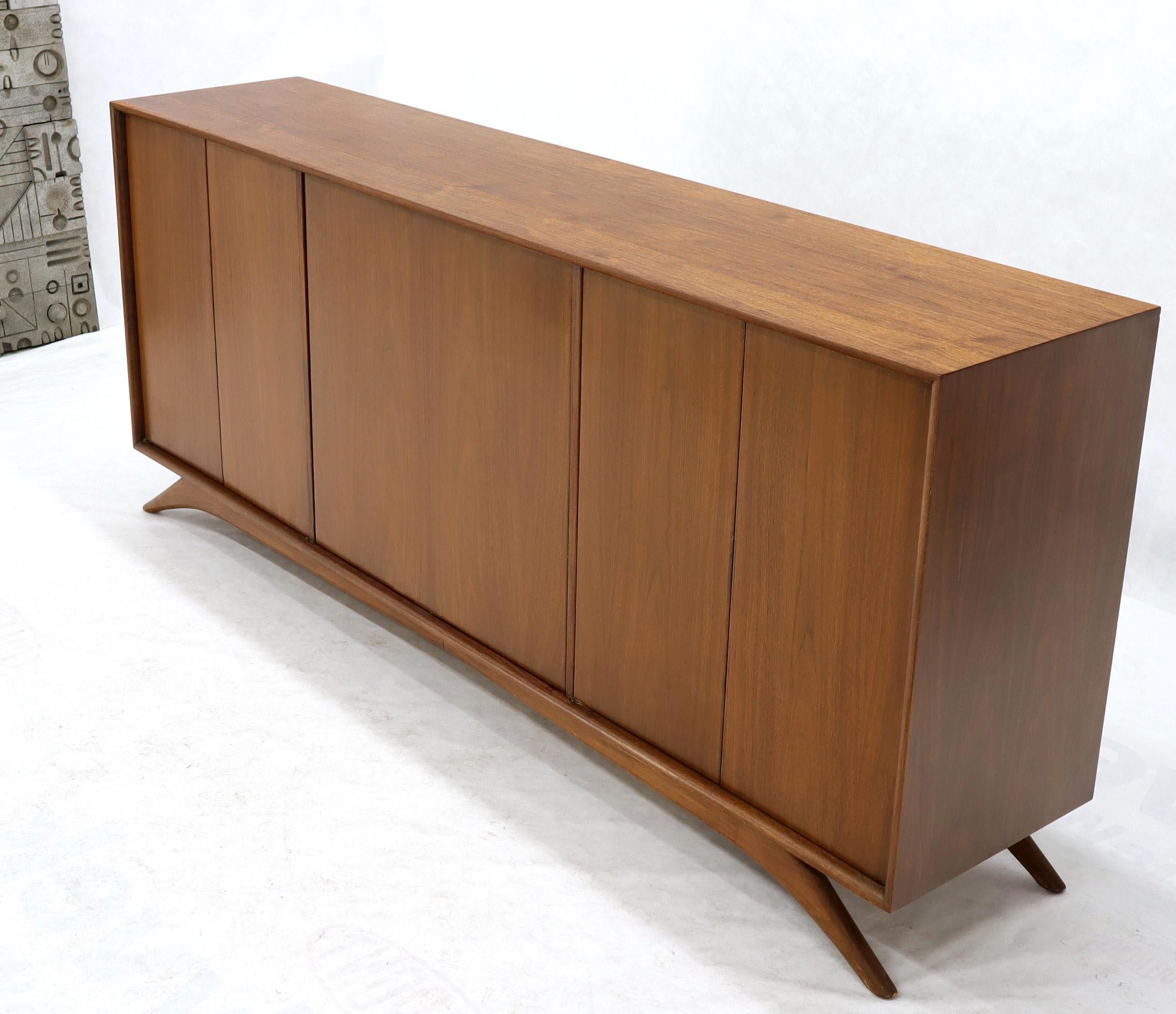 Kagan influence sculptural legs Mid-Century Modern three compartment side board credenza with swivel bar in the centre compartment. Beautiful walnut finish. When fully open the centre bar column light up.