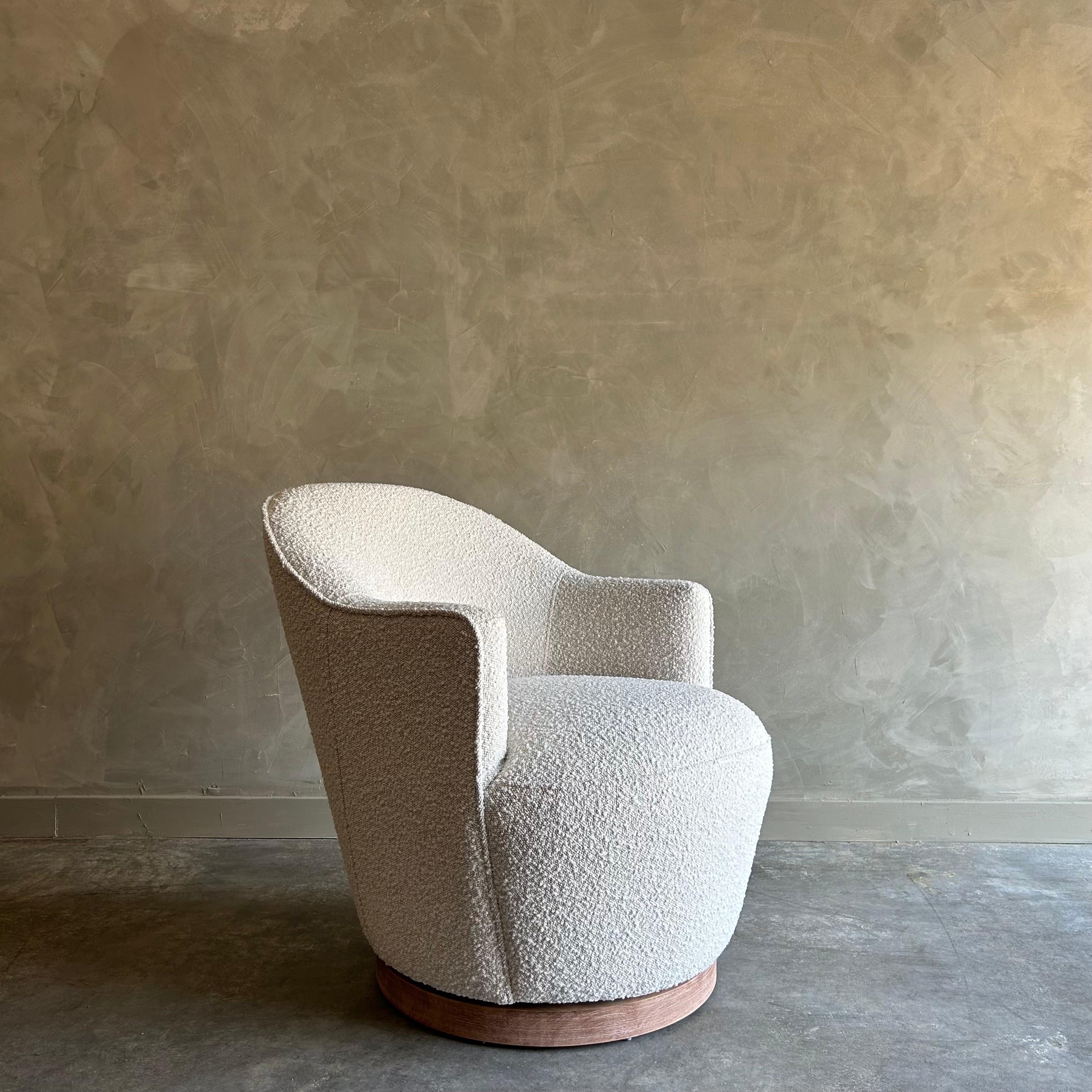 Boucle Swivel Chair 
Size: 28”w x 30”d x 31”h. 
SH: 18”. 
SD:21”. 
AH:24”
Petite in size, this swivel chair is both comfortable with a tight seat and tight back, giving it a more modern look.
The boucle is in ivory cream on a natural background.
The