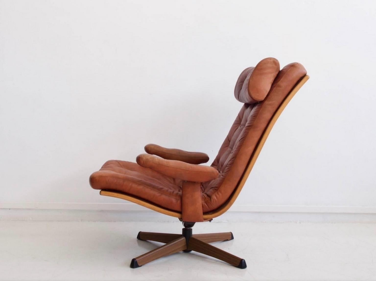 Easy chair by Göte Möbler. Button tufted brown leather upholstered seat and armrests. Leather with slight age-related patina. Frame of wood and steel. Very comfortable seat.