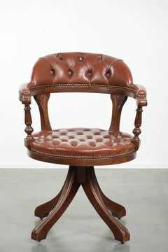 Swivel cowhide English style chesterfield office chair in a brown colour