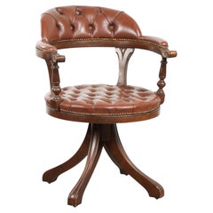 Swivel cowhide English style chesterfield office chair in a brown colour