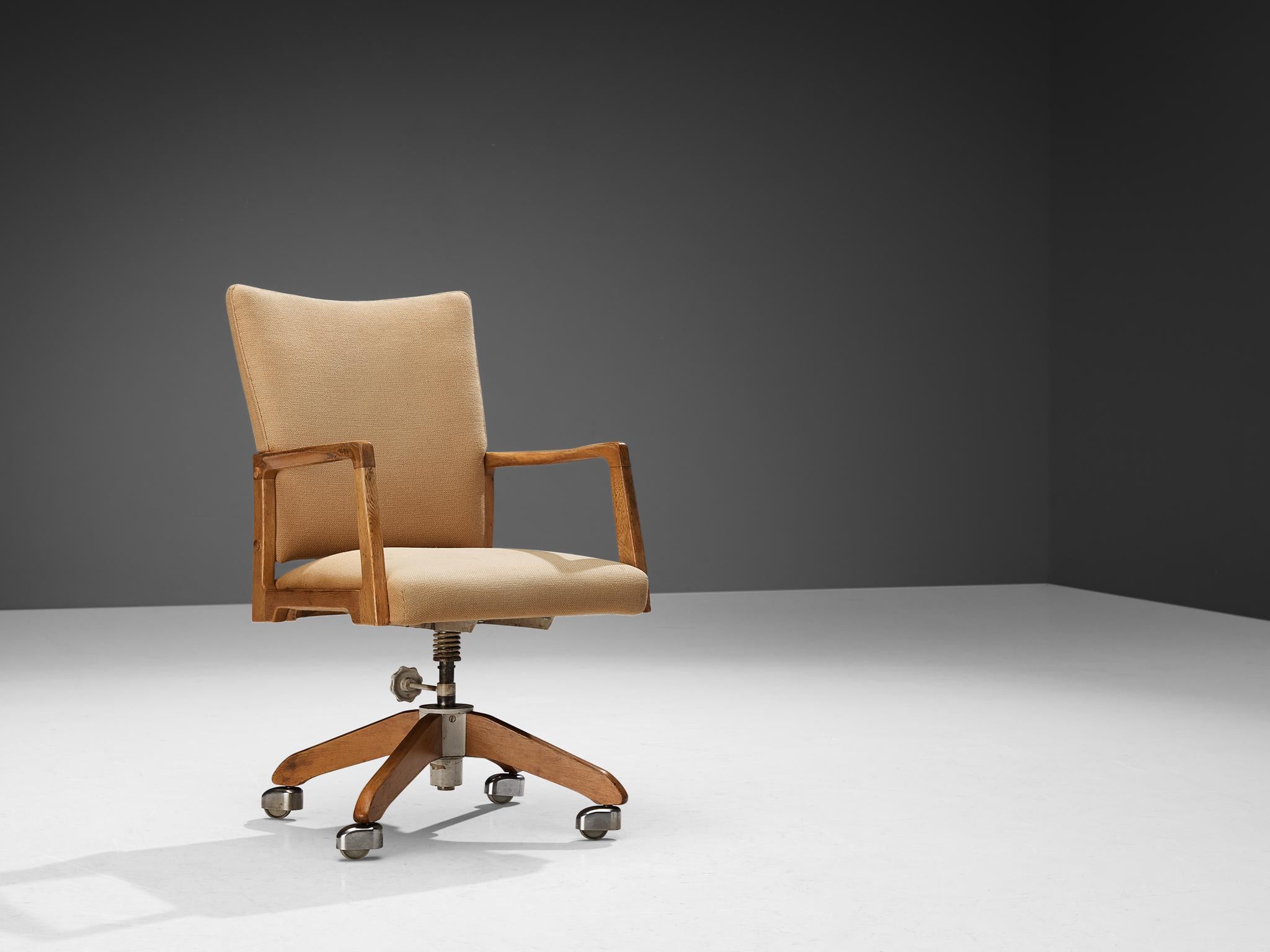 Swivel desk chair, beech, oak, chromed metal, plastic, wool, Europe, 1960s

Nicely sculpted office chair based on an interesting composition of geometrical shapes. The armrests feature an open frame based on a cubic form and executed in oak. The