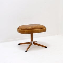 Swivel footrest in brown leather with metal base - De Sede, Switzerland.