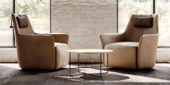 Poltrona contemporanea con schienale alto e base girevole