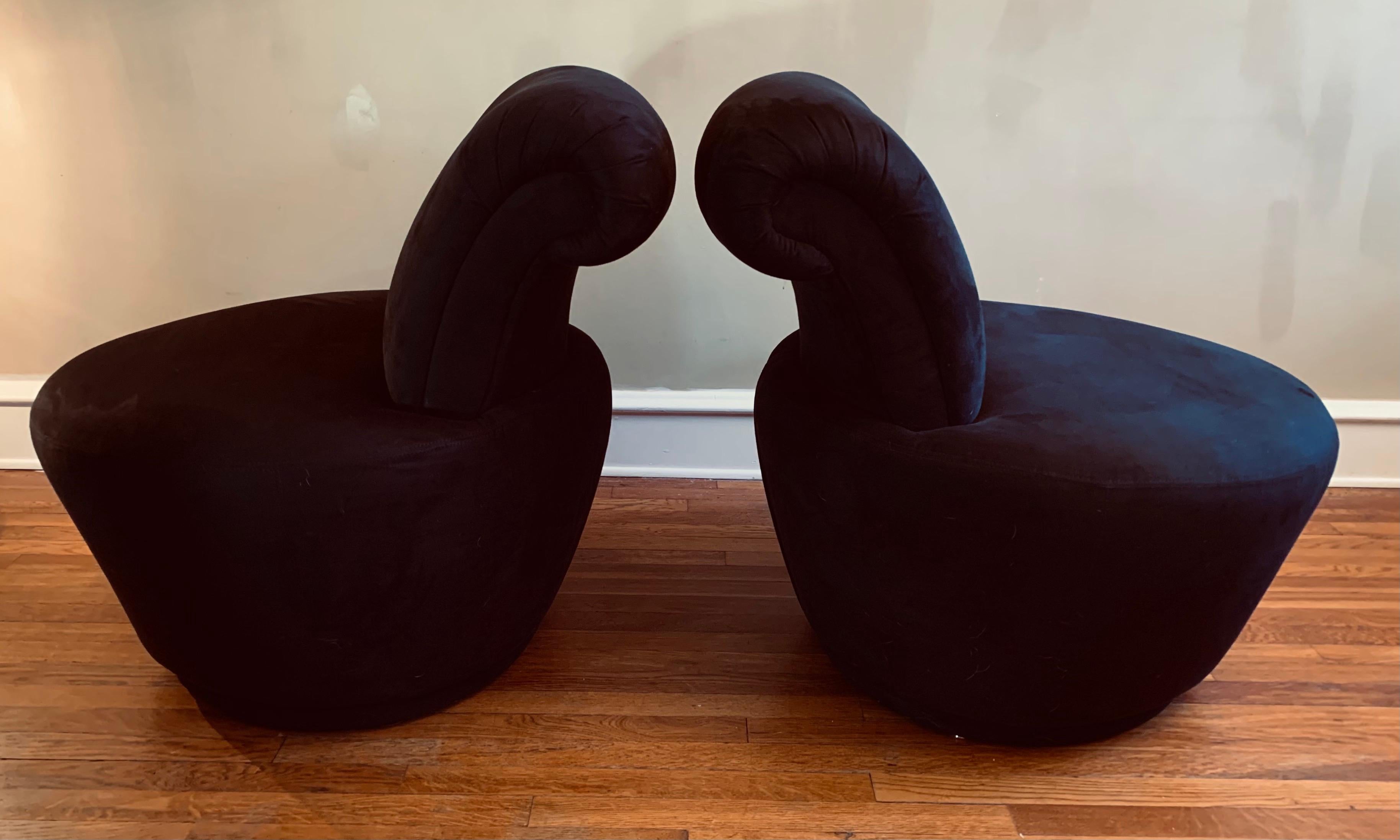 Handsome pair of Vladimir Kagan for Weiman swivel chairs. 

Black ultra suede upholstery is in excellent condition.

Swivels function smoothly and quietly. 

While these chairs are more diminutive than many of Kagan's creations, they still