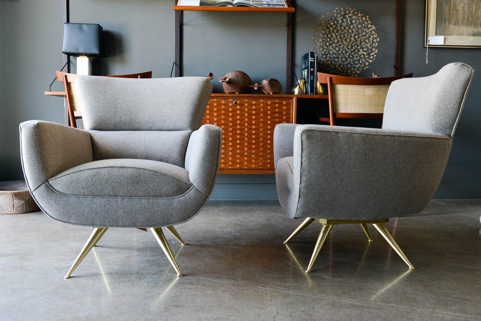 Swivel lounge chairs with brass legs by Henry P. Glass, circa 1955. Stunning design, these chairs feature a solid polished brass base on 4 sculptural legs with a swivel base that moves 360 degrees smoothly. Professionally restored to exacting