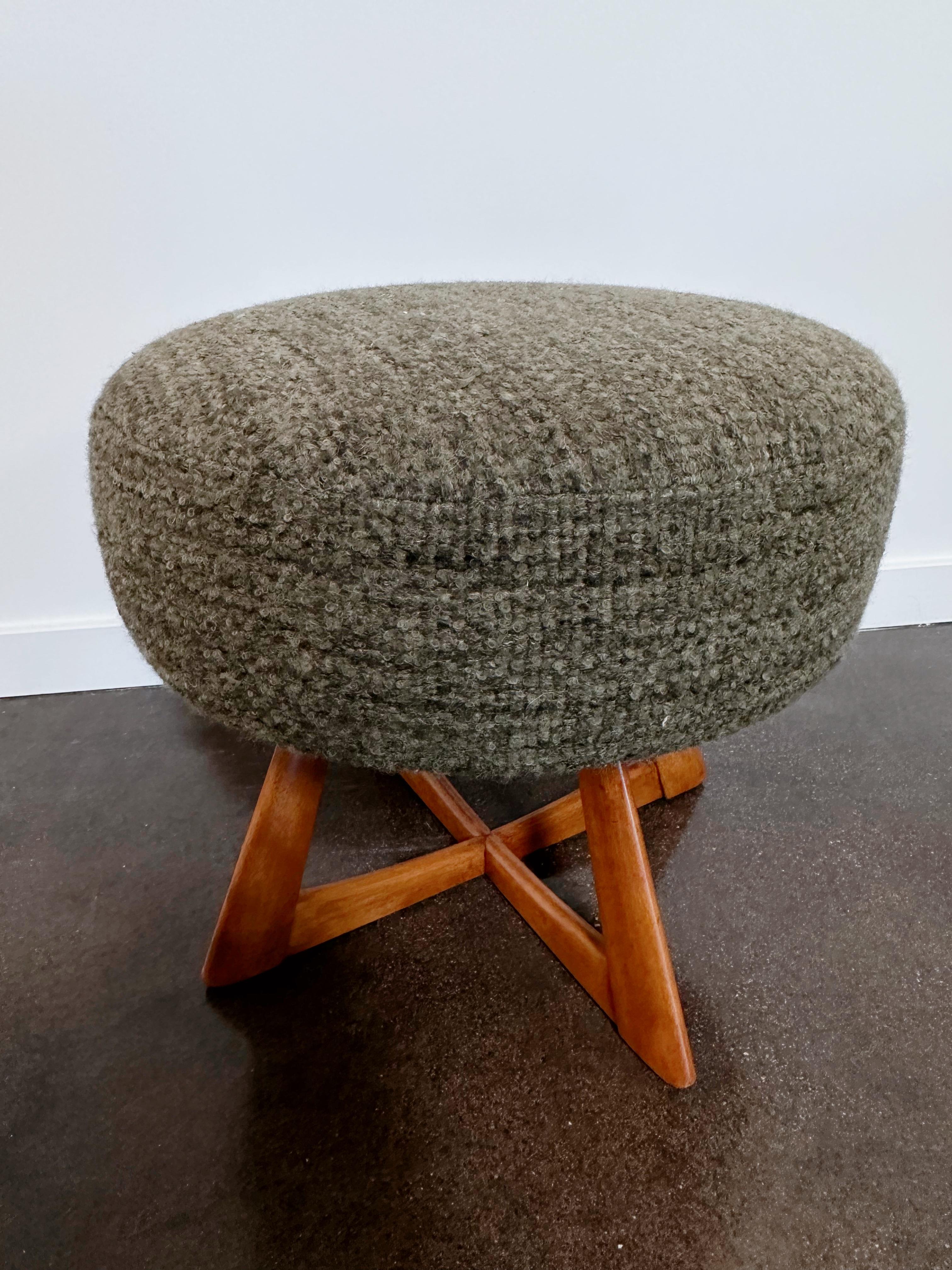 A swivel ottoman by furniture company Heywood Wakefield. The top has been redesigned and reupholstered in a Rosemary Hallgarten Alpaca. The cross legged maple base has been refinished and restored by us. 

About Heywood Wakefield
Established in
