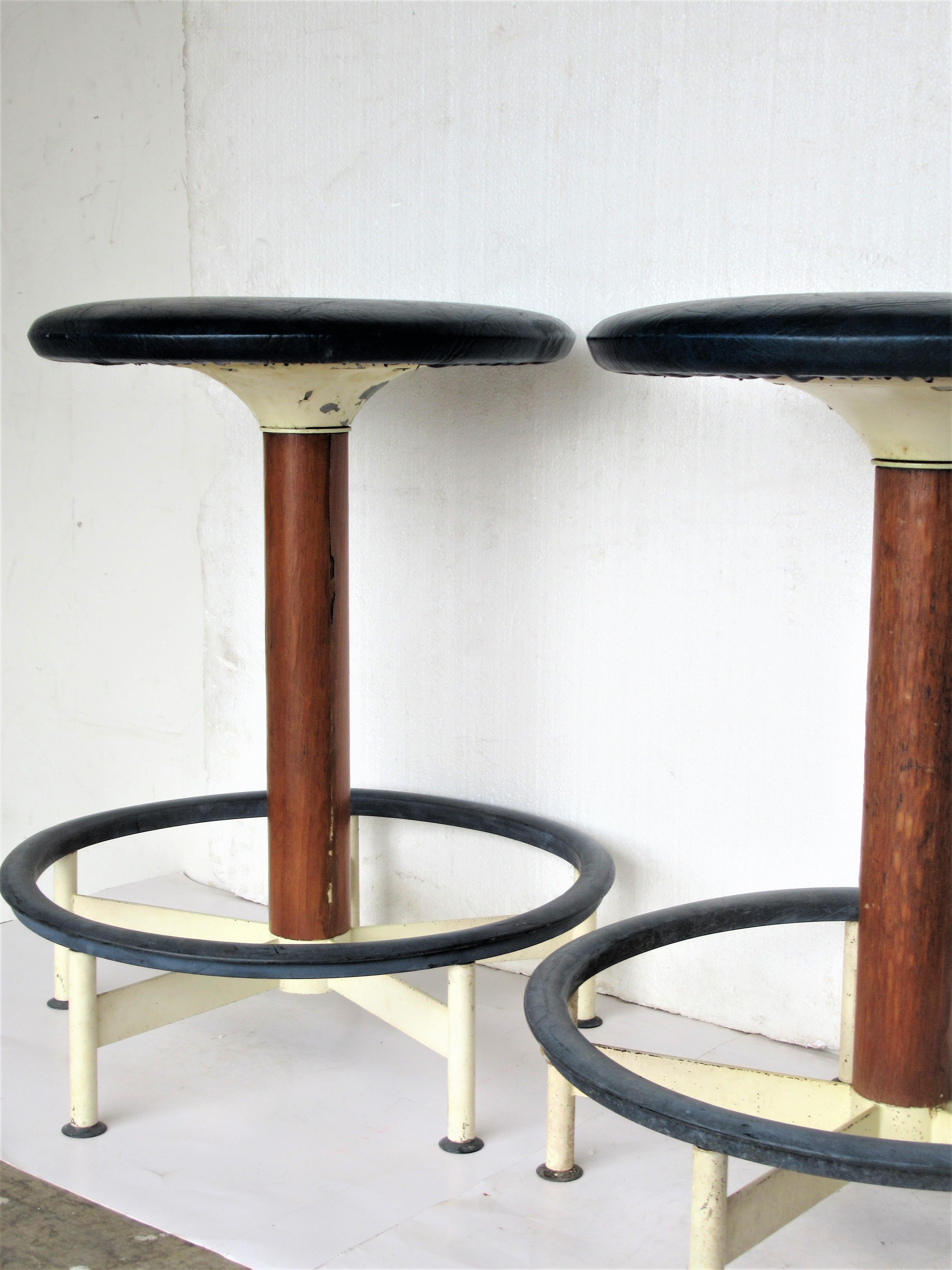 Matching pair of mid-20th century modern circular swivel stools by Burke Inc. in all original vintage condition. Circa 1960. We think these are an uncommon hard to find form. Look at all pictures and read condition report in comment section.