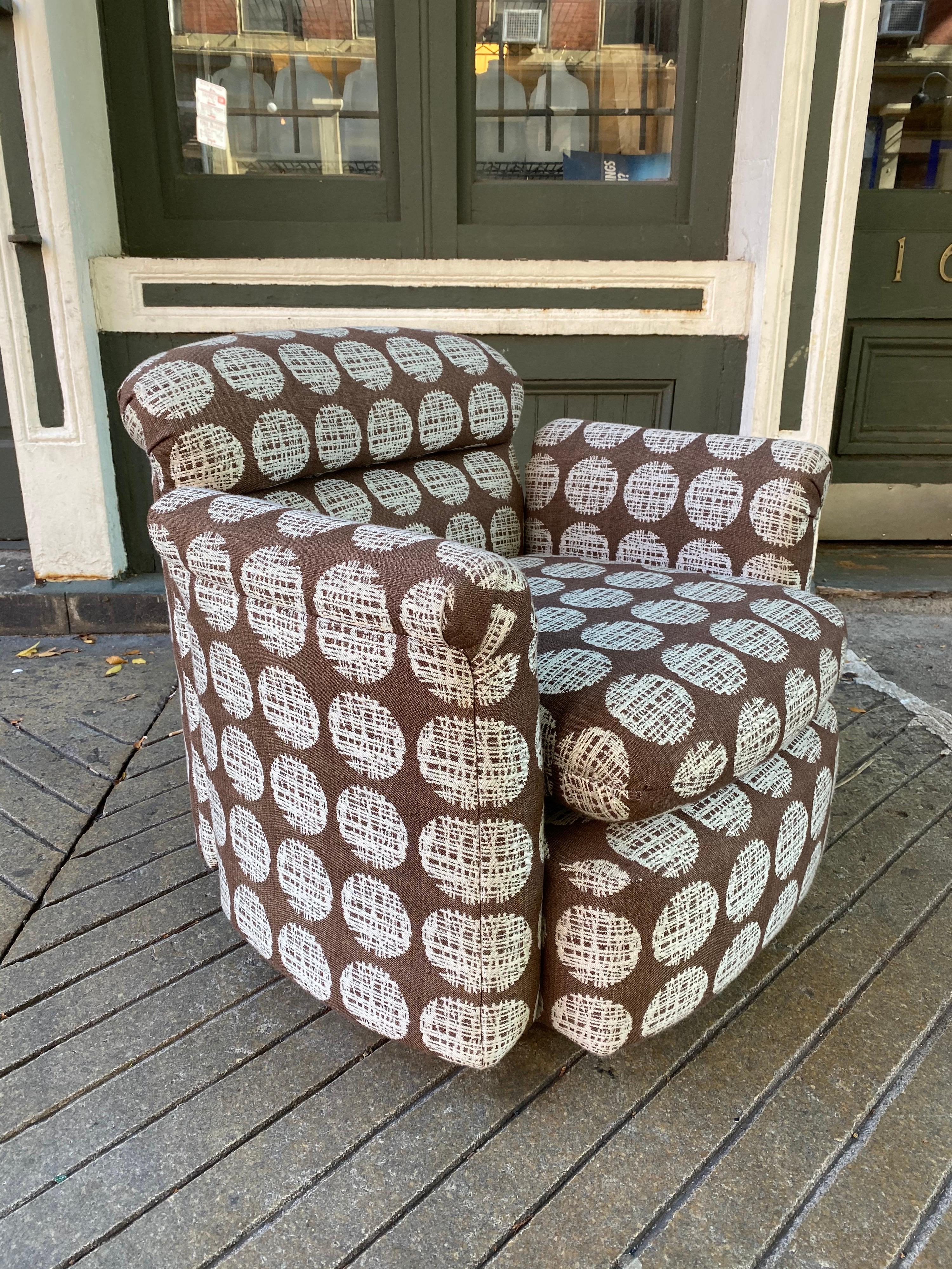 Swivel Tub chair. Newly reupholstered and ready to go! Very solid and well made! Base has a chrome strip. Turns easily! Possibly manufactured by Directional!?