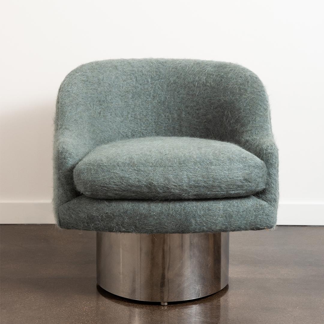 This 1970's inspired tub lounge chair with a chrome swivel base has been refinished and reupholstered by the Selby House in a Pierre Frey mohair / wool blend