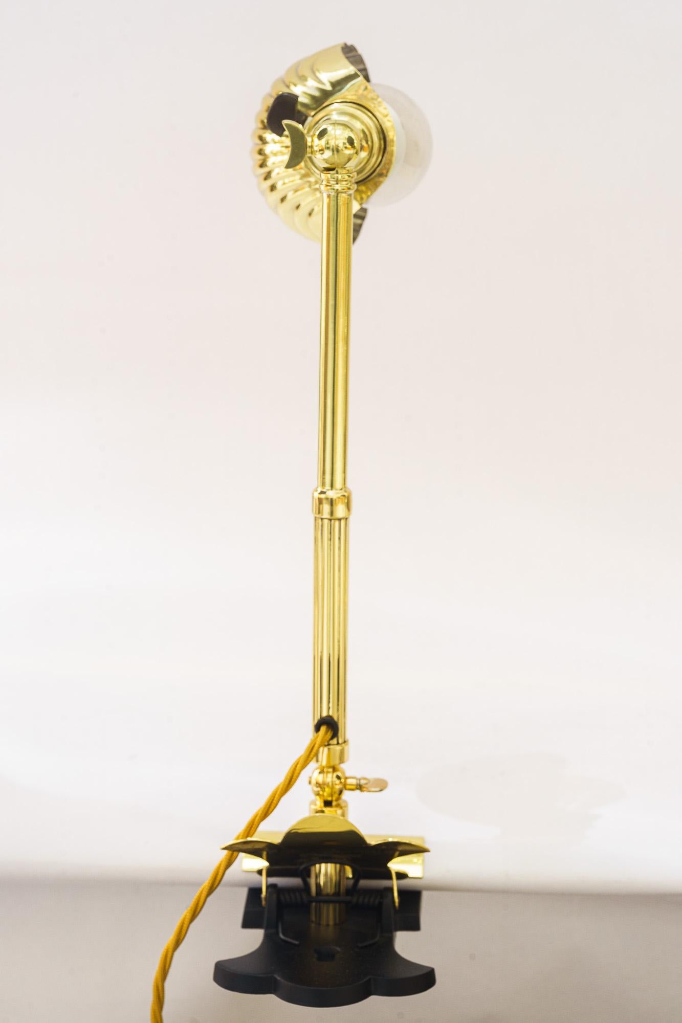 Swiveling Art Deco  Clamp Table Lamp, circa around 1920s
Brass polished and stove enameled
Metal blackened