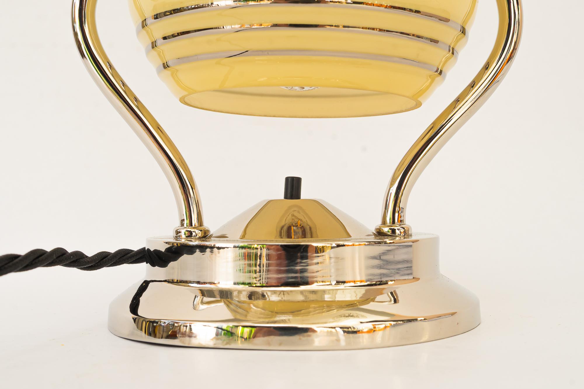 Swiveling Art Deco nickel table lamp with glass vienna around 1920s
Original condition