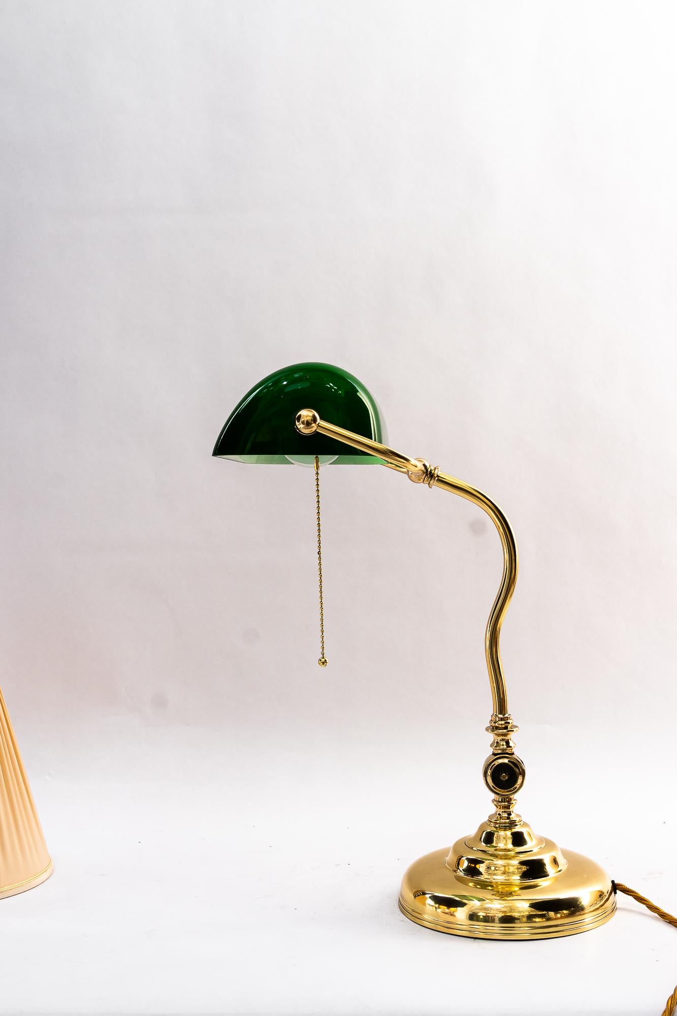 Swiveling banker table lamp vienna around 1920s
Brass polished and stove enameled