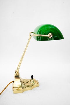 Swiveling Banker table lamp with green glass shade vienna around 1920s
