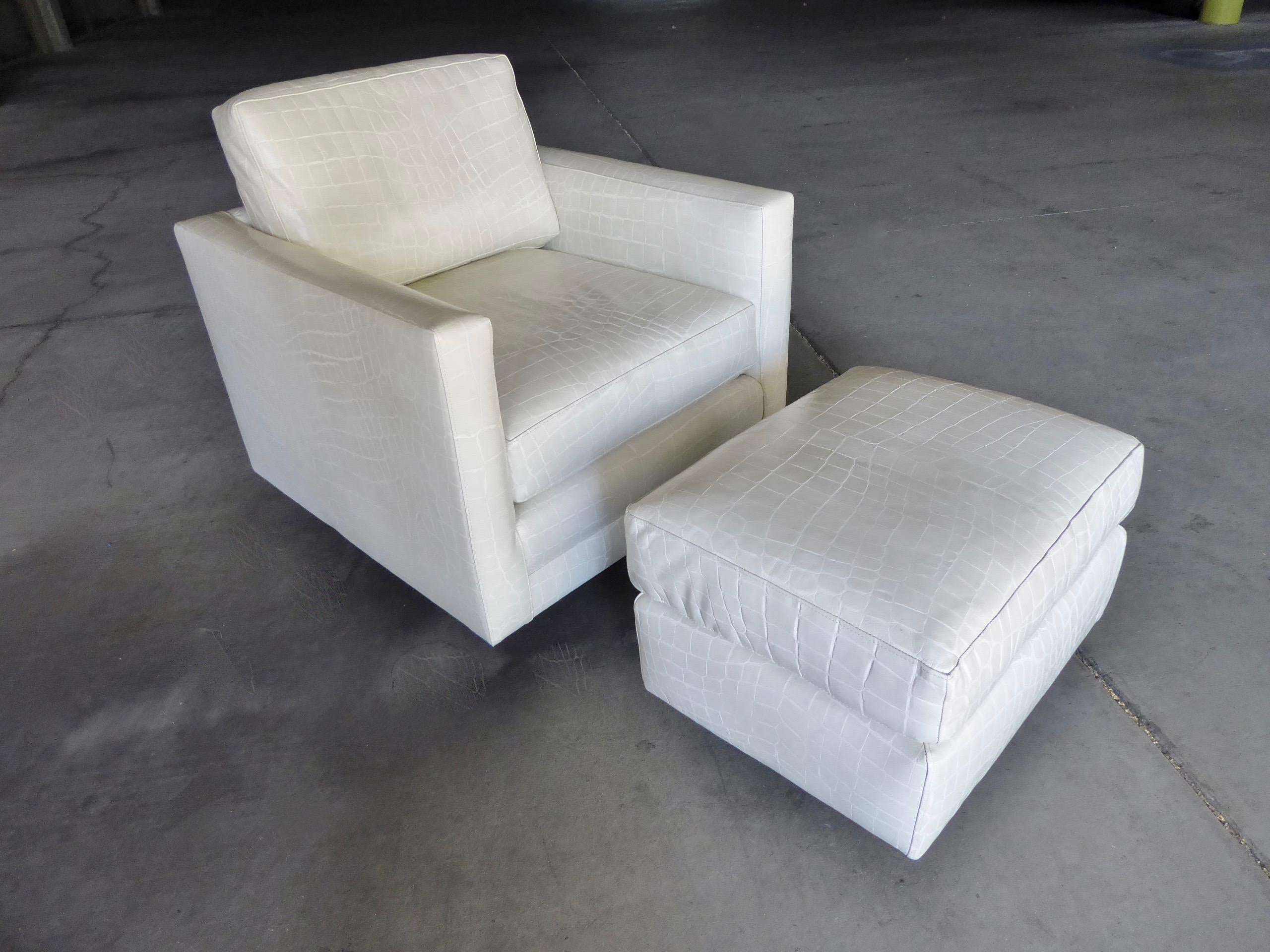 A super comfortable and stylish swiveling club chair and ottoman in the style of Milo Baughman. This chair was recently upholstered with an alligator pattern embossed high quality leather. Dimensions provided for listing are for the chair alone.