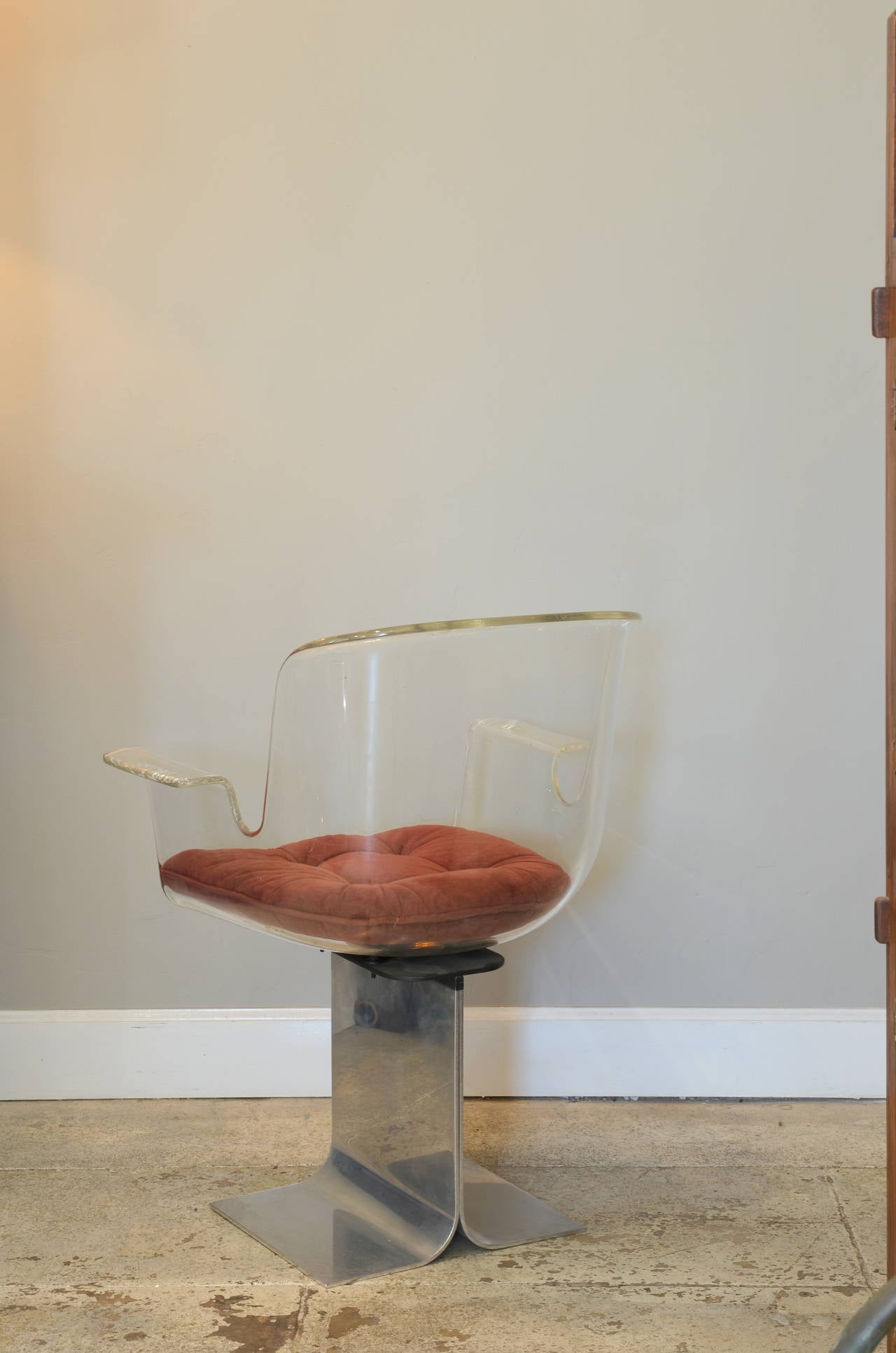Late 20th Century Swiveling Lucite and Polished Aluminum Armchair by Irving Rosen for Pace