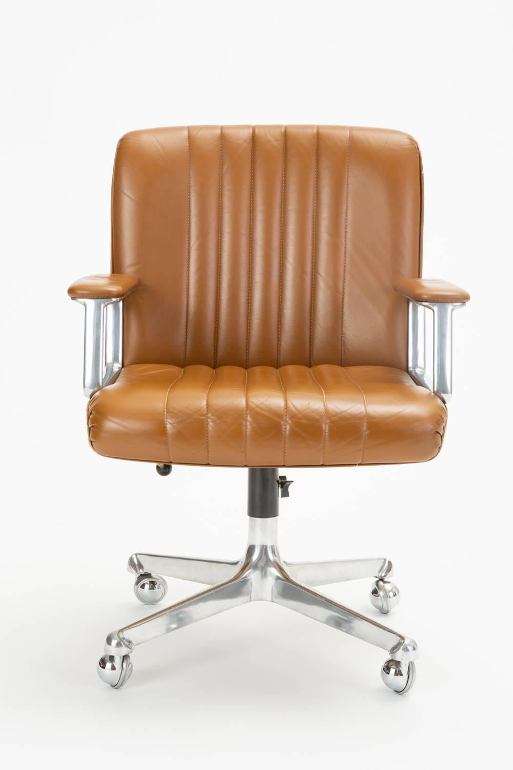 The P125 office chair was designed by Osvaldo Borsani in 1966 for his company Tecno Collection and produced through 1976. The swiveling office chair is constructed in polished aluminum, chrome, and leather. The chair has a four star aluminum base