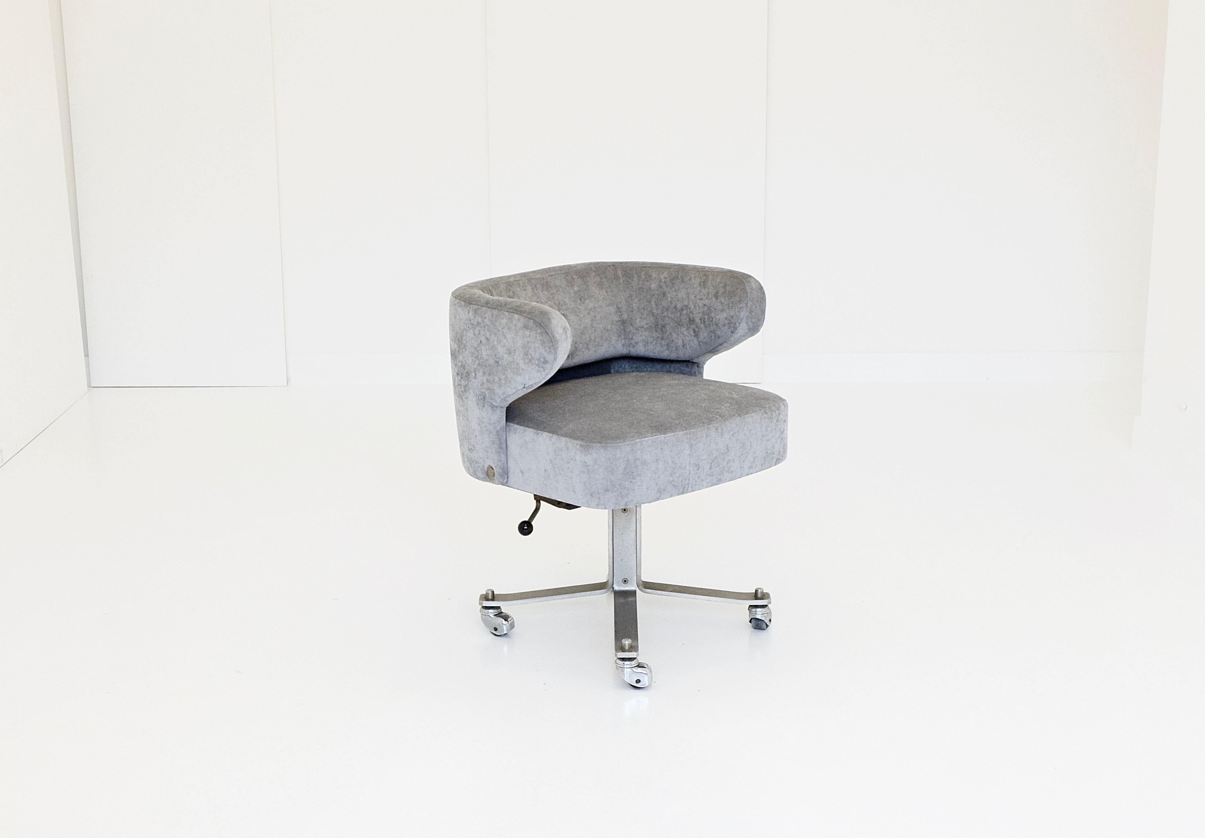 A swivelling, height adjustable desk chairs, solid brushed steel base, 4-star-legs forming a mono column, revolving padded seat with back/arm shell, covered with pearl grey velvet. Gianni Moscatelli for Formanova, circa 1970. Formanova makers mark