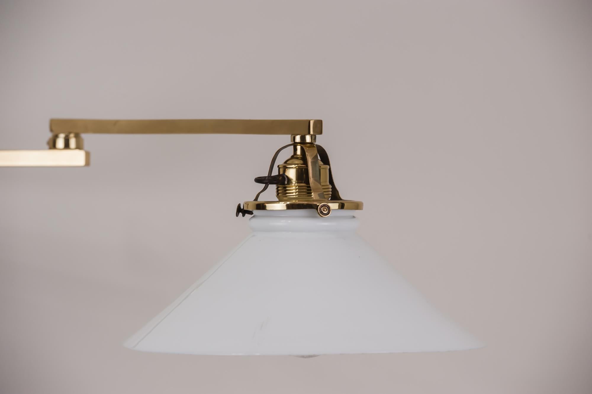 Swivelling wall lamp, 1920s
Polished and stove enameled.

Original shade.