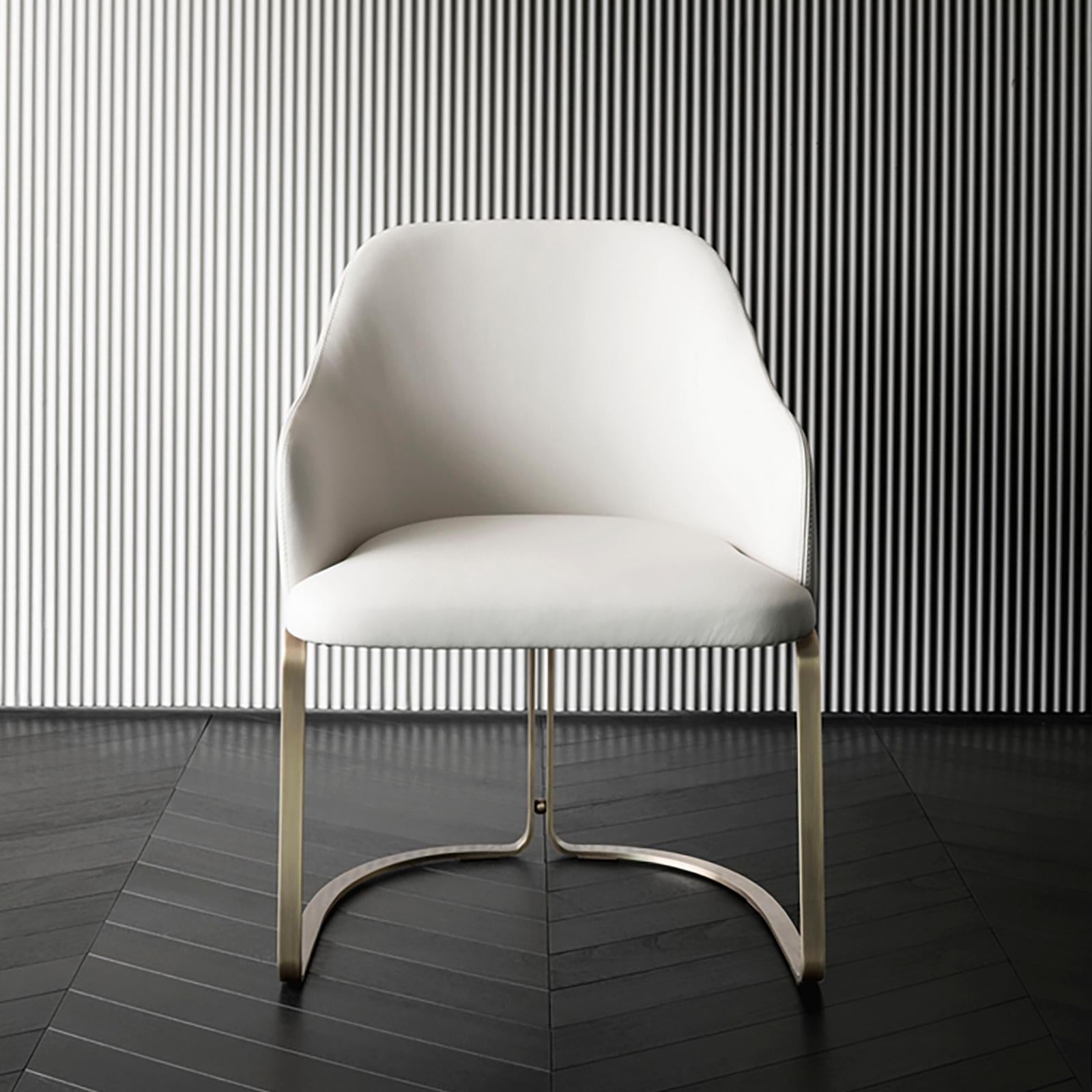 Armchair Sybil with structure in solid wood,
with bronze base, upholstered and covered 
with italian high quality white leather.
Also available with fabric or other leather colors
on request.
     