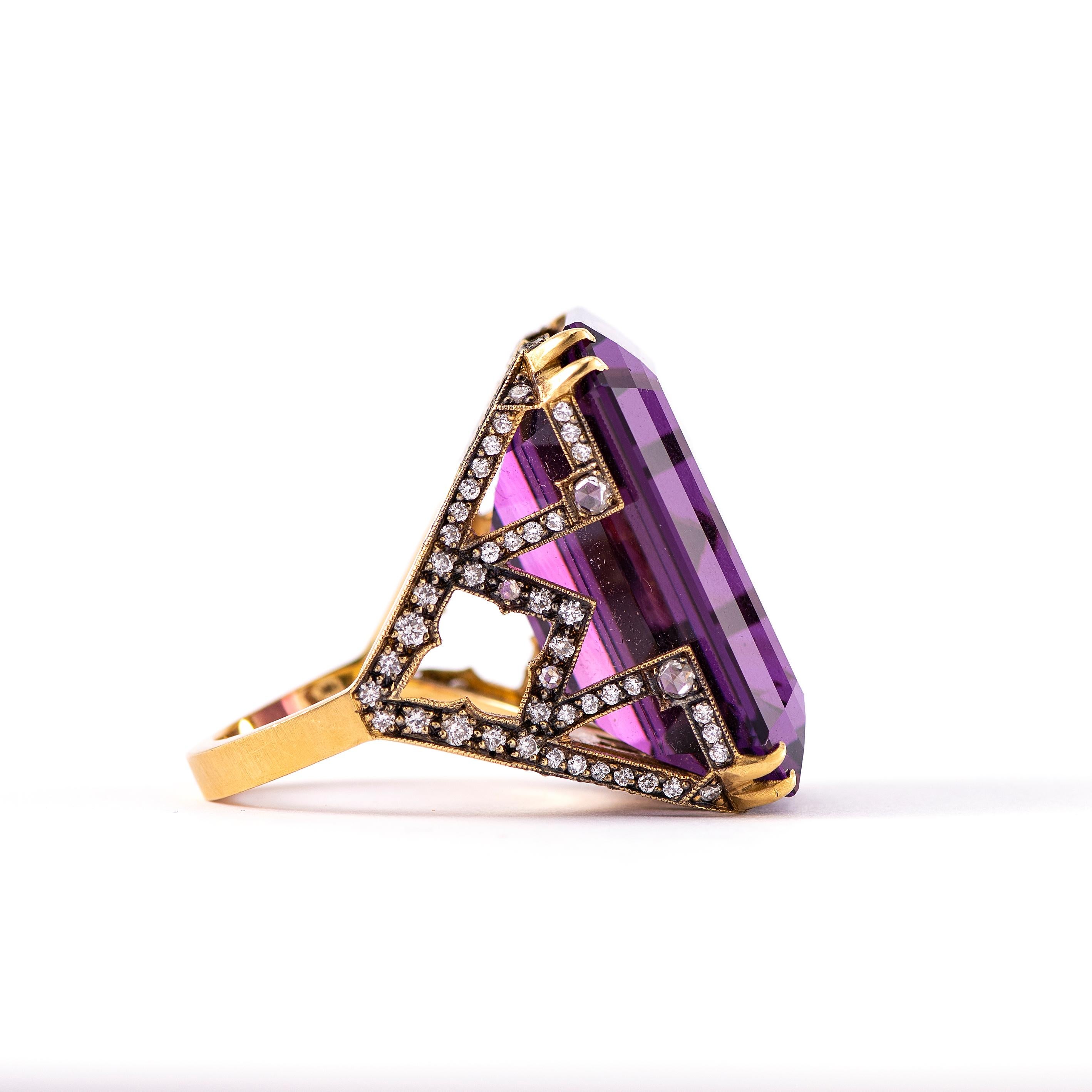 For the person who has everything, enter this unmistakable, eye-catching amethyst cocktail ring.  The emerald cut amethyst is the focal point from the top, but turn to the side and the adventure continues with white diamond pave set in an intricate